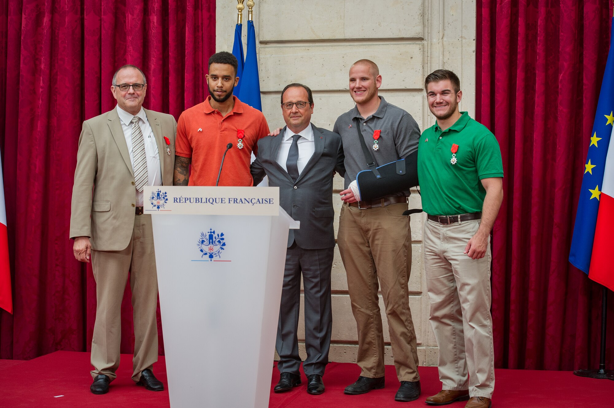 French President Fran??ois Hollande poses with the four men who thwarted a terrorist attack on a French train during a Legion of Honor ceremony at the ??lys??e in Paris Aug. 24, 2015. Stone was on vacation with his childhood friends, Aleksander Skarlatos and Anthony Sadler, when an armed gunman entered their train carrying an assault rifle, a handgun and a box cutter. The three friends, with the help of a British passenger, subdued the gunman after his rifle jammed. Stone???s medical training prepared him to begin treating wounded passengers while waiting for the authorities to arrive. Stone is an ambulatnce service technician with the 65th Medical Operations Squadron stationed at Lajes Field, Azores. (U.S. Air Force photo/Tech. Sgt. Ryan Crane)