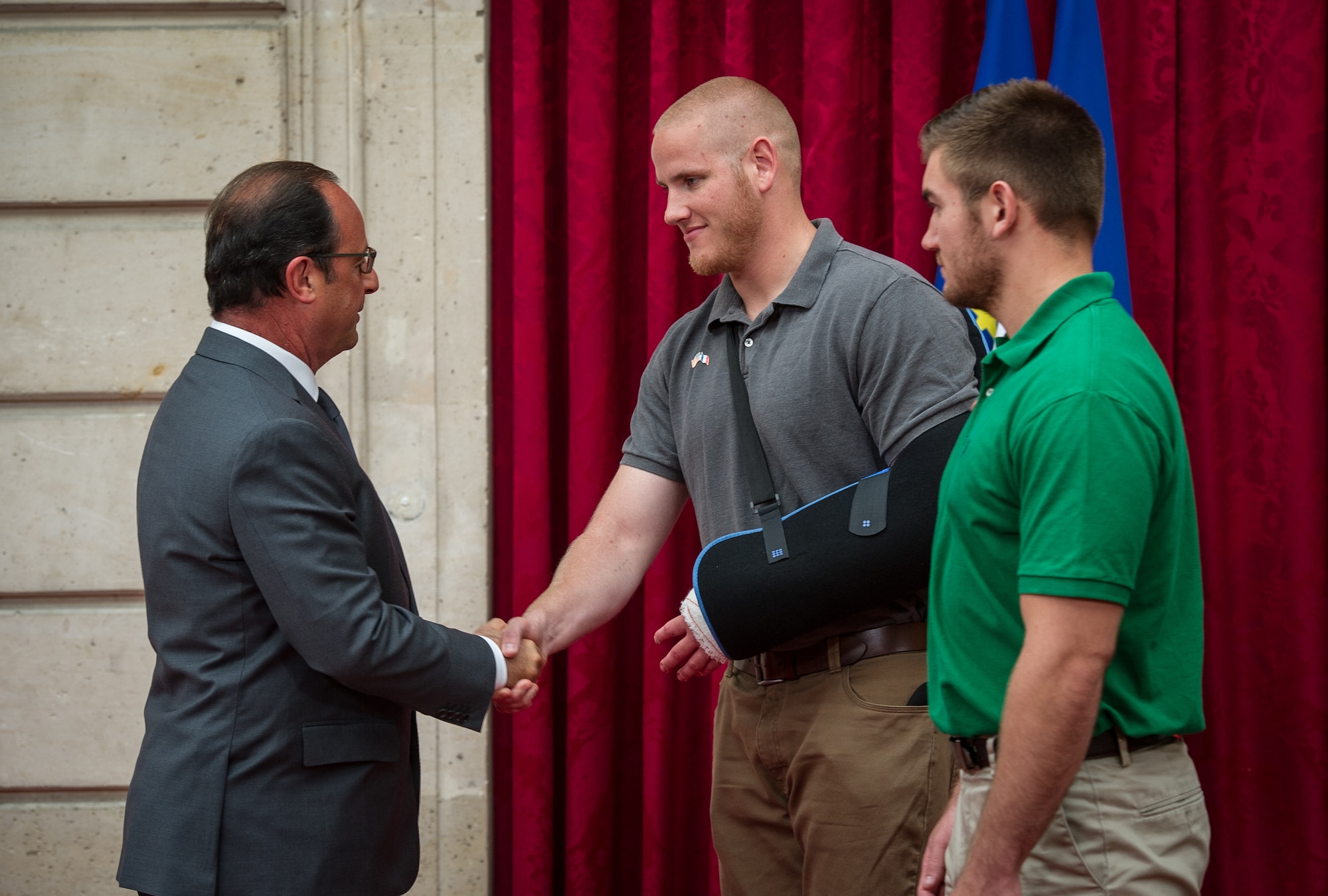 U.S. Airman 1st Class Spencer Stone shakes hands with French President Fran??ois Hollande at his home in Paris Aug. 24, 2015, following a foiled attack on a French train. Stone was on vacation with his childhood friends, Aleksander Skarlatos and Anthony Sadler, when an armed gunman entered their train carrying an assault rifle, a handgun and a box cutter. The three friends, with the help of a British passenger, subdued the gunman after his rifle jammed. Stone???s medical training prepared him to begin treating wounded passengers while waiting for the authorities to arrive. Stone is an ambulance service technician with the 65th Medical Operations Squadron stationed at Lajes Field, Azores. (U.S. Air Force photo/Tech. Sgt. Ryan Crane)