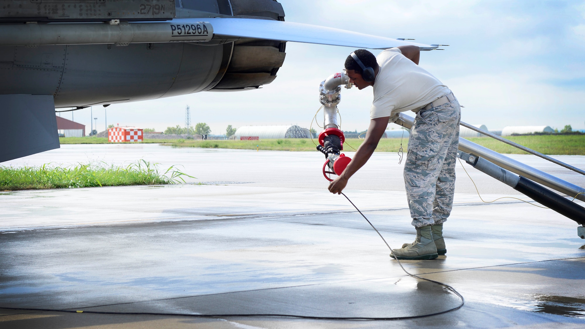 U.S. Air Force Airman Samuel Harrell, 31st Logistics Readiness Squadron petroleum oils and lubricants facility technician, prepares to fuel an F-16 Fighting Falcon, Aug. 25, 2015, at Aviano Air Base, Italy. Airmen from POL are responsible for receiving, storing and tracking all petroleum products used by government vehicles and aircraft at Aviano Air Base, Italy. (U.S. Air Force photo by Senior Airman Areca T. Wilson/Released)