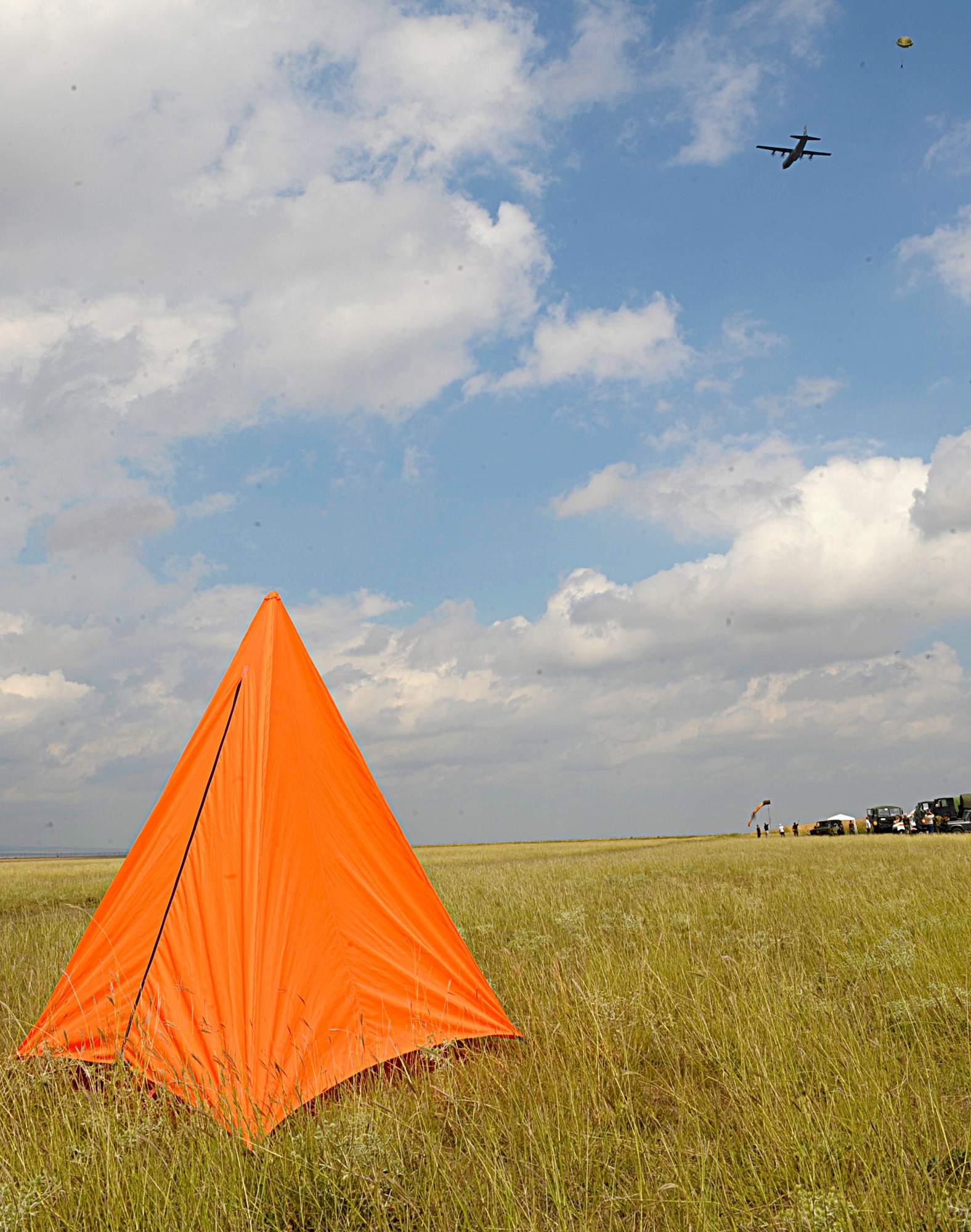 An orange cone marks the location of the drop zone for C-130J Super Hercules pilots during a training exercise of Carpathian Summer Aug. 18, 2015, at Boboc Air Base, Romania. Three C-130Js participated in exercise Carpathian Summer, a two-week long bilateral training event designed to increase readiness and interoperability between the U.S. Air Force and Romanian air force. (U.S. Air Force photo/Senior Airman Timothy Moore)