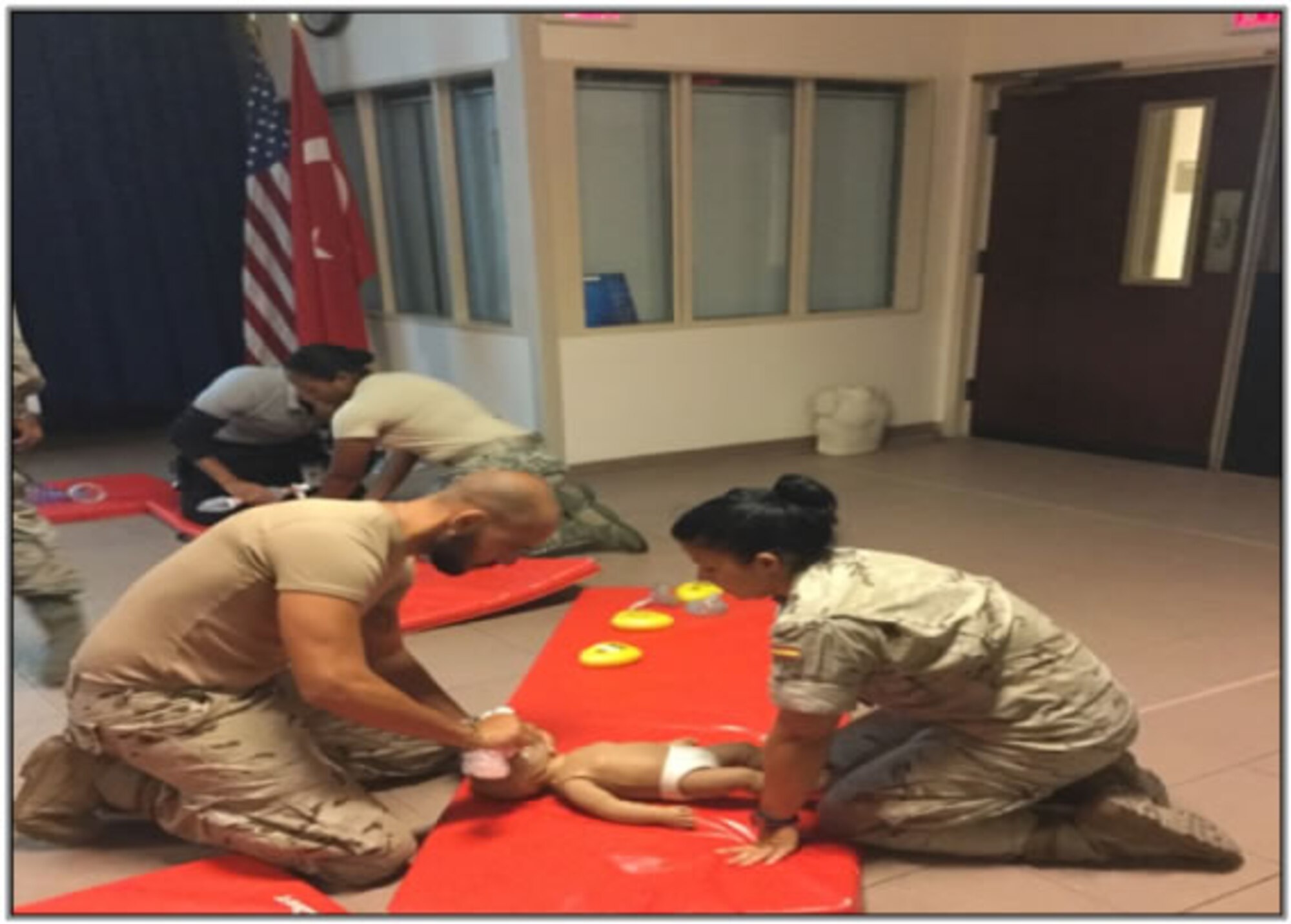 Two Spanish Patriot Unit medical staff members practice cardiopulmonary resuscitation on a child manikin during training August 5, 2015 at the 39th Medical Group, August 5, 2015 at Incirlik Air Base, Turkey. The participants received theoretical and hands-on training on performing first-aid for heart attacks in adults and children. (Photo by Spanish Army Private Jose Linares)