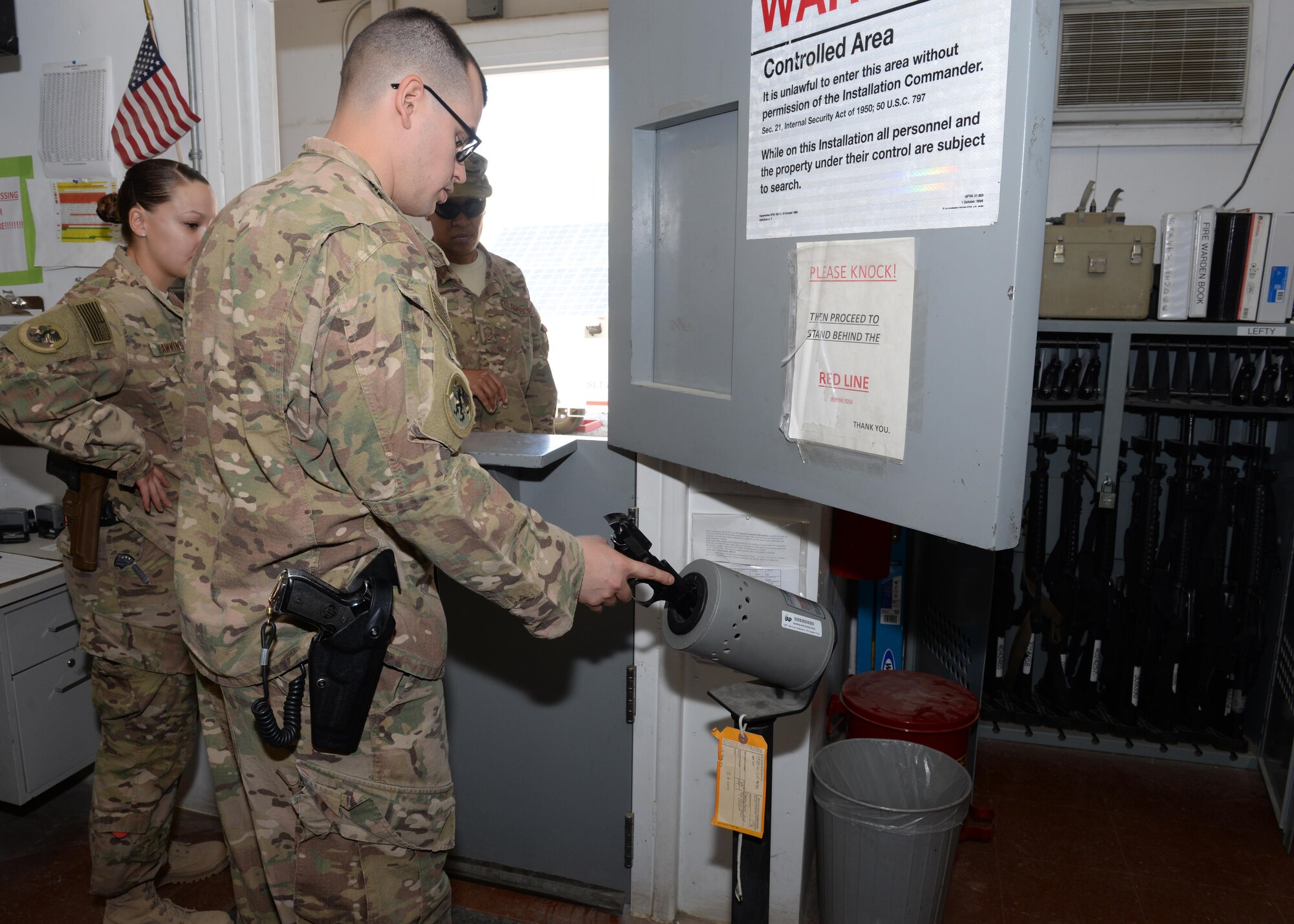 U.S. Air Force Staff Sgt. Joshua Sharp, 455th Expeditionary Logistics Readiness Squadron armory, clears out a weapon prior to issuing it to a customer Aug. 26, 2015, at Bagram Airfield, Afghanistan. The armory team is responsible for issuing weapons to Airmen of the 455th AEW that do not deploy with but require a weapon during their deployment. (U.S. Air Force photo by Senior Airman Cierra Presentado/Released)