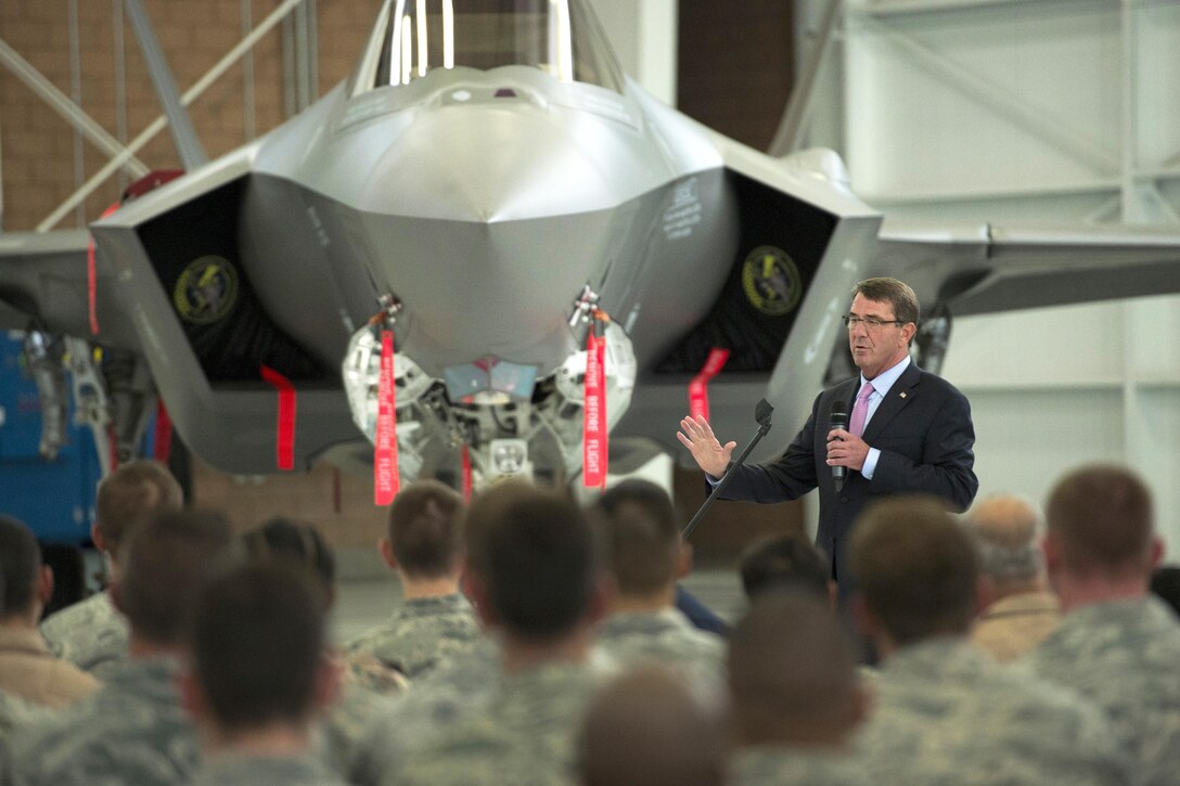 Defense Secretary Ash Carter speaks with service members while visiting Nellis Air Force Base, Nev., Aug. 26, 2015. Carter also observed part of the ongoing Red Flag training exercise during his visit. DoD photo by Air Force Master Sgt. Adrian Cadiz