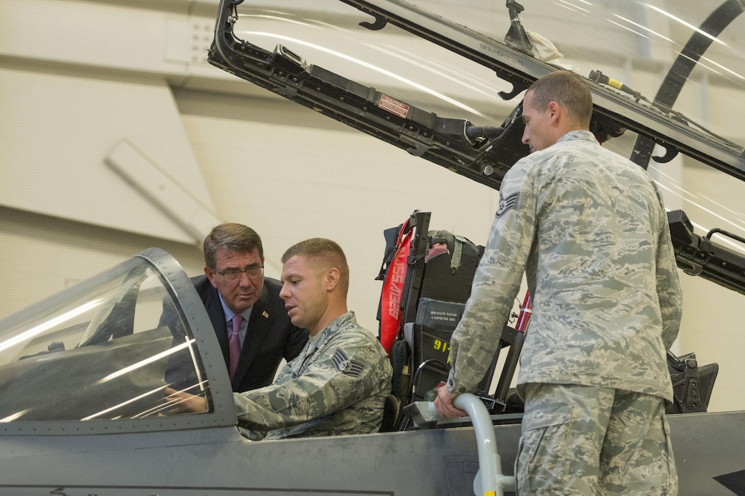 Defense Secretary Ash Carter speaks with airmen working as aircraft maintainers during a visit to Nellis Air Force Base, Nev., Aug. 26, 2015. DoD photo by Master Sgt. Adrian Cadiz