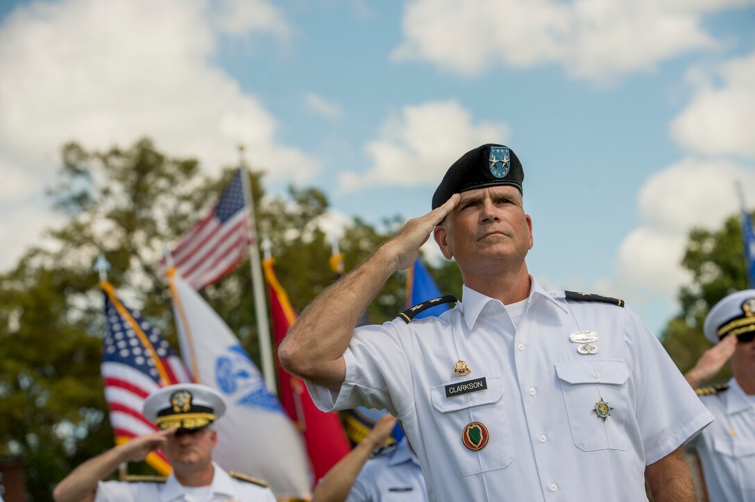 Army Maj. Gen. David G. Clarkson, chief of staff of U.S. Transportation Command, salutes as Defense Secretary Ash Carter is welcomed onto the parade field during an assumption-of-command ceremony on Scott Air Force Base, Ill., Aug. 26, 2015. Air Force Gen. Darren W. McDew assumed leadership of the command during the ceremony. DoD photo by U.S. Air Force Master Sgt. Adrian Cadiz