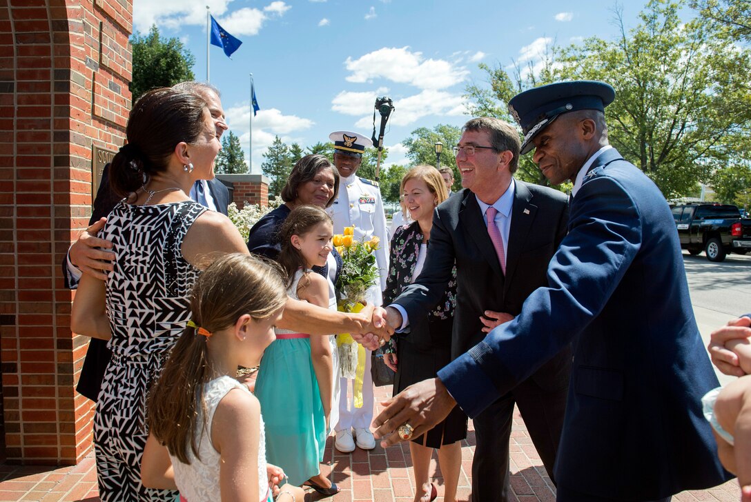 Defense Secretary Ash Carter and Air Force Gen. Darren W. McDew greet guests at the U.S. Transportation Command assumption-of-command ceremony on Scott Air Force Base, Ill., Aug. 26, 2015. McDew assumed leadership of the command during the ceremony. DoD photo by U.S. Air Force Master Sgt. Adrian Cadiz