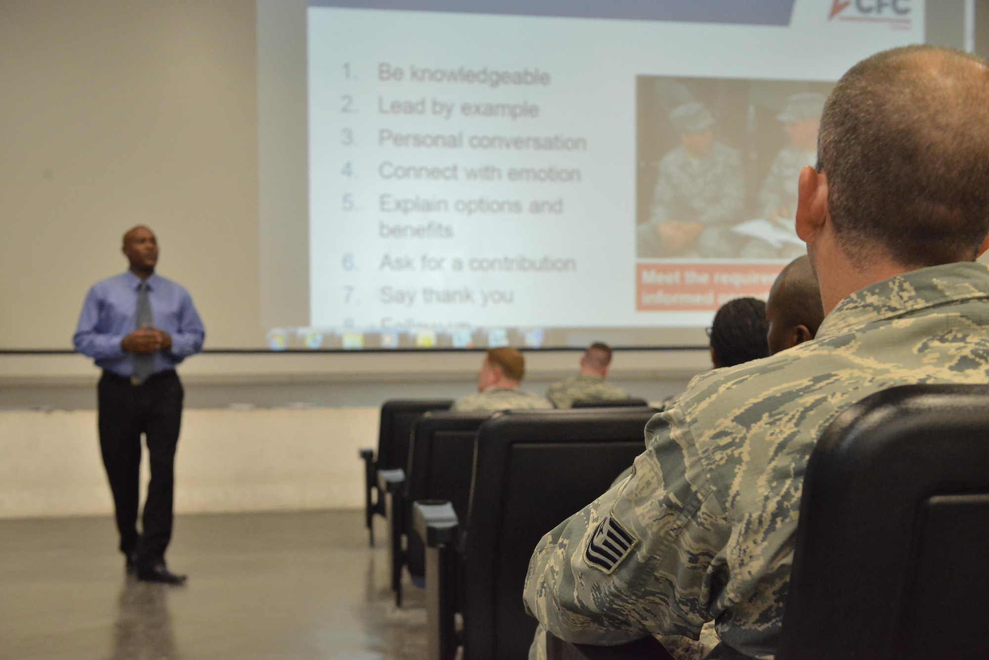 Chidley Lafontant, Combined Federal Campaign-Overseas manager, briefs key personnel about their duty as volunteers for the CFC-O program August 27, 2015 at Al Udeid Air Base, Qatar. CFC gives military members the opportunity to contribute through donations for various charities. The campaign will begin September 21st and run through November 21st. (U.S. Air Force photo/Staff Sgt. Alexandre Montes)