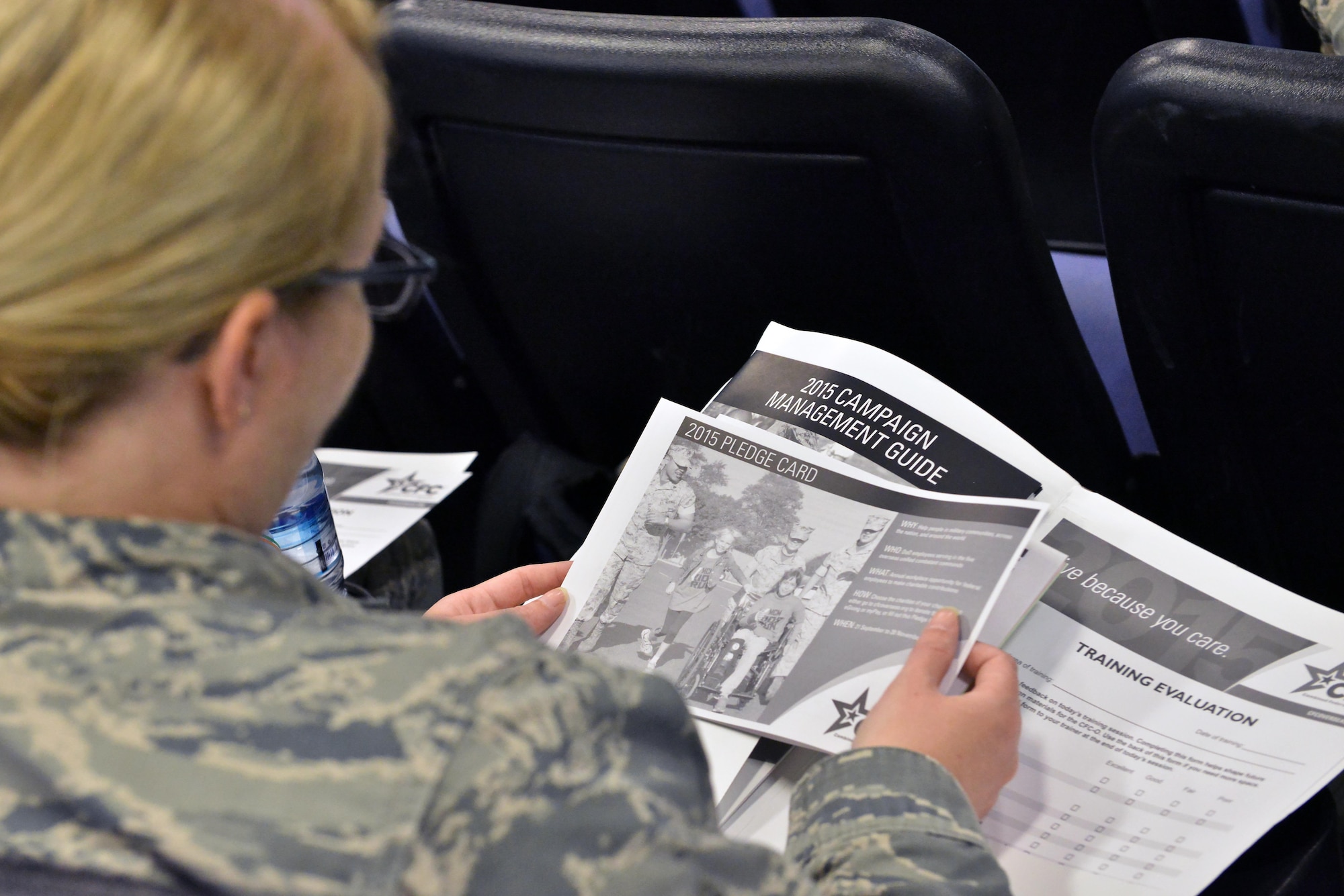 Combined Federal Campaign-Overseas key personnel receive their initial packets to begin kick-off training for the 2015 program August 27, 2015 at Al Udeid Air Base, Qatar. CFC gives military members the opportunity to contribute through donations for various charities. The campaign will begin September 21st and conclude November 21st. (U.S. Air Force photo/Staff Sgt. Alexandre Montes)