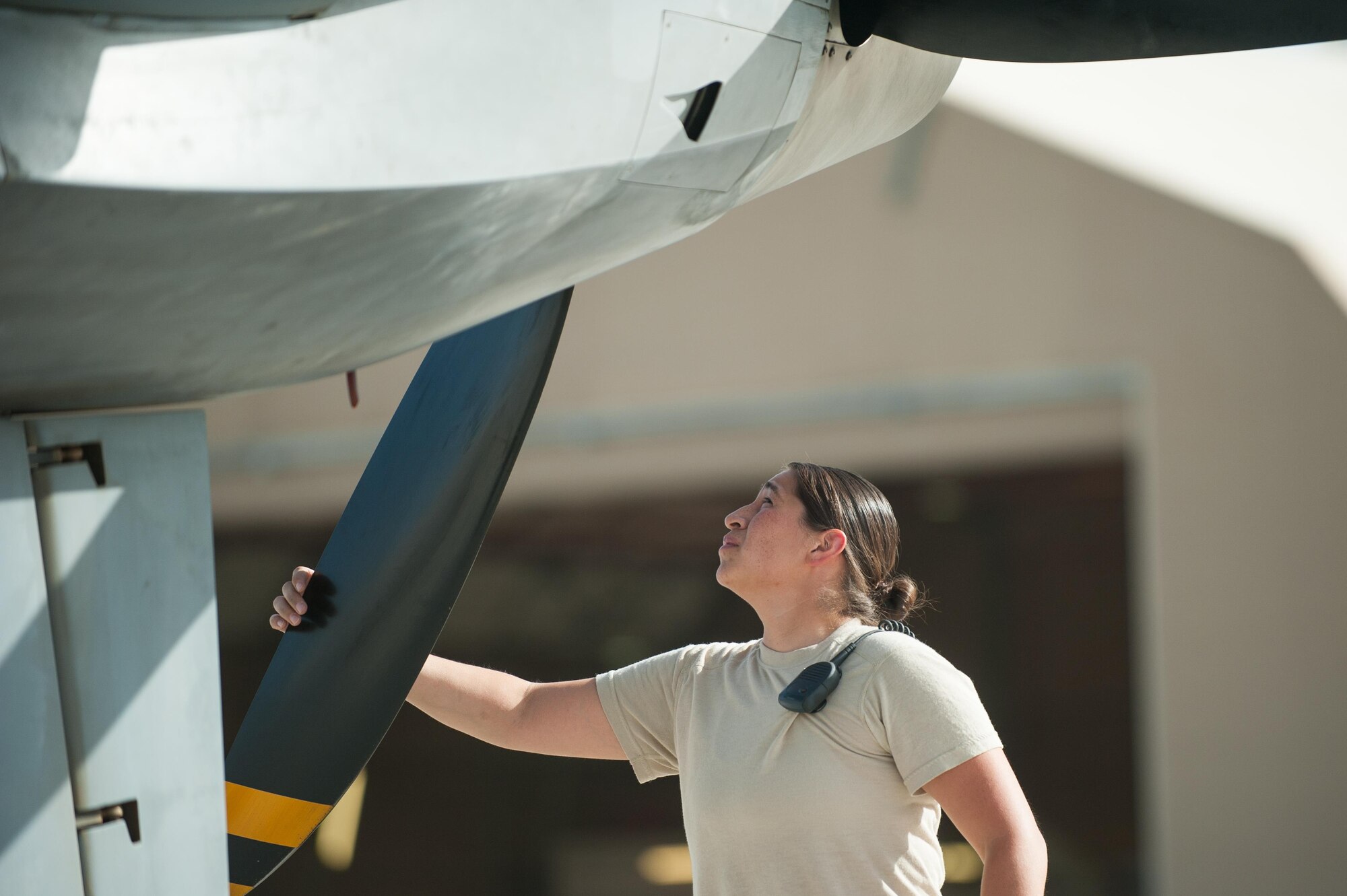 U.S. Air Force Senior Airman Sarah Morales, 62nd Expeditionary Reconnaissance Squadron MQ-9 Reaper aircraft technician, preforms a preflight inspection on a Reaper at Kandahar Airfield, Aug. 14, 2015. Morales keeps the Reapers at KAF in the air by performing routine maintenance on the aircraft as well as launching and recovering them to keep the missions and sorties going. (U.S. Air Force photo by Tech. Sgt. Joseph Swafford/Released)