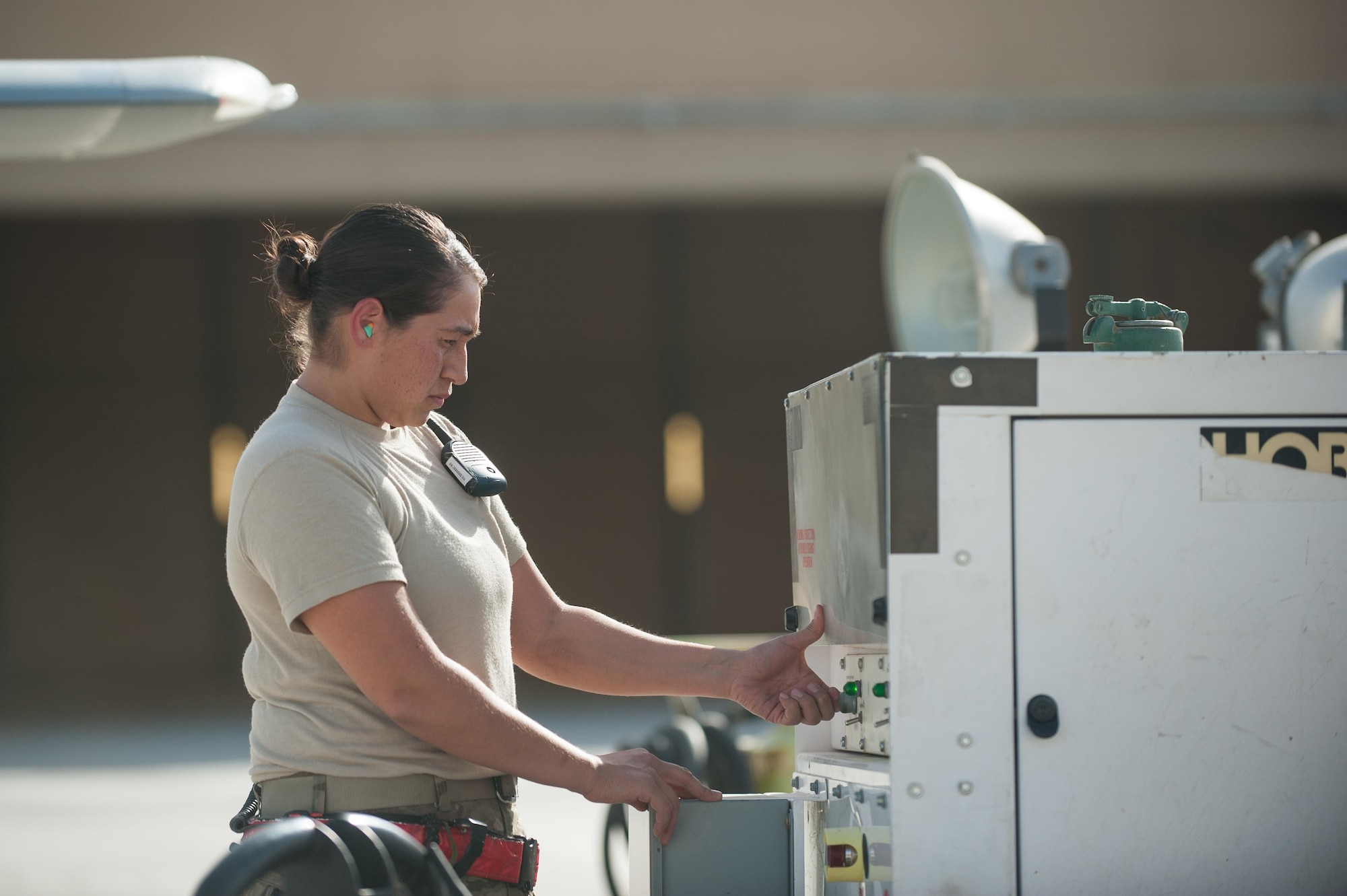 U.S. Air Force Senior Airman Sarah Morales, 62nd Expeditionary Reconnaissance Squadron MQ-9 Reaper aircraft technician, preforms a preflight inspection on a Reaper at Kandahar Airfield, Aug. 14, 2015. Morales keeps the Reapers at KAF in the air by performing routine maintenance on the aircraft as well as launching and recovering them to keep the missions and sorties going. (U.S. Air Force photo by Tech. Sgt. Joseph Swafford/Released)