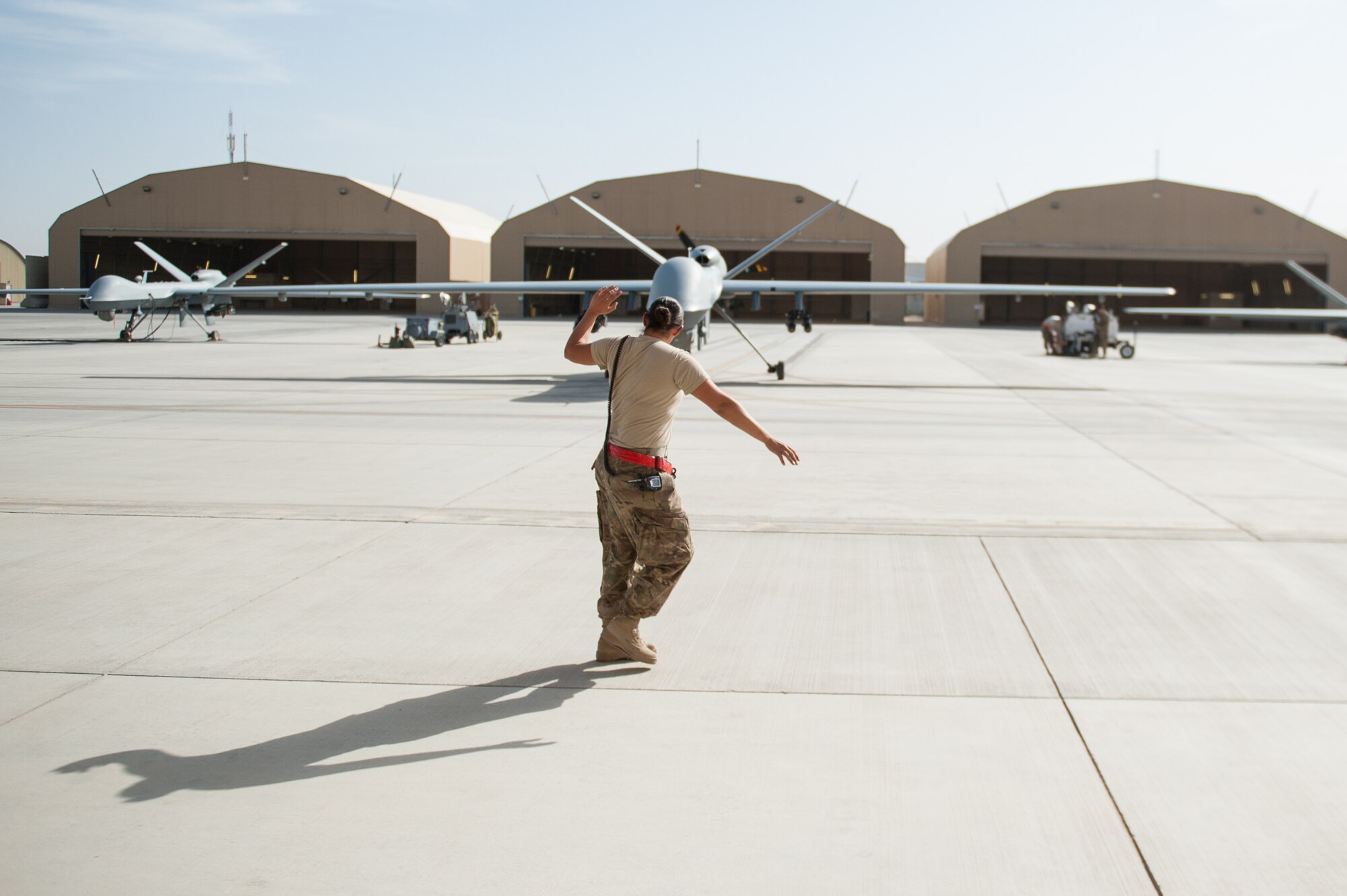 U.S. Air Force Senior Airman Sarah Morales, 62nd Expeditionary Reconnaissance Squadron MQ-9 Reaper aircraft technician, launches a Reaper at Kandahar Airfield, Aug. 14, 2015. Morales keeps the Reapers at KAF in the air by performing routine maintenance on the aircraft as well as launching and recovering them to keep the missions and sorties going. (U.S. Air Force photo by Tech. Sgt. Joseph Swafford/Released)