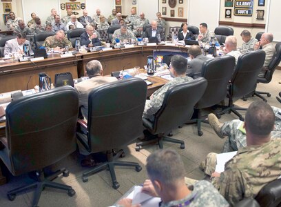 Maj. Gen. K.K. Chinn, U.S. Army South commanding general, leads the visiting former Army South commanders and command staff during a command brief at the Army South headquarters on Fort Sam Houston Aug. 10.