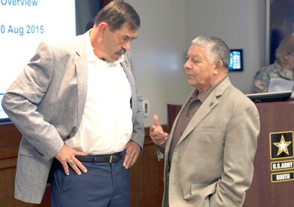 Retired Maj. Gen. Simeon G. Trombitas (left), U.S. Army South commanding general from November 2009 to September 2012, speaks with retired Maj. Gen. Alfred A. Valenzuela, ARSOUTH CG from July 2000 to October 2003, during a break in the former commanders’ conference at the command’s headquarters on Fort Sam Houston Aug. 10.