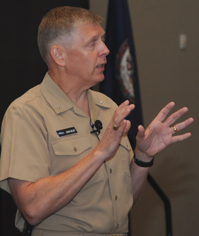 Naval Surface Warfare Center (NSWC) Commander Rear Adm. Lorin Selby speaks to unmanned systems experts from the government, industry, and academia at NSWC Dahlgren Division's second annual Unmanned Systems Integration Workshop and Technical Exchange Meeting, Aug. 19. Selby encouraged military innovators and business executives to overcome the challenges they face to obtain funding for new technologies that can rapidly become a program of record and deployed to the warfighter.