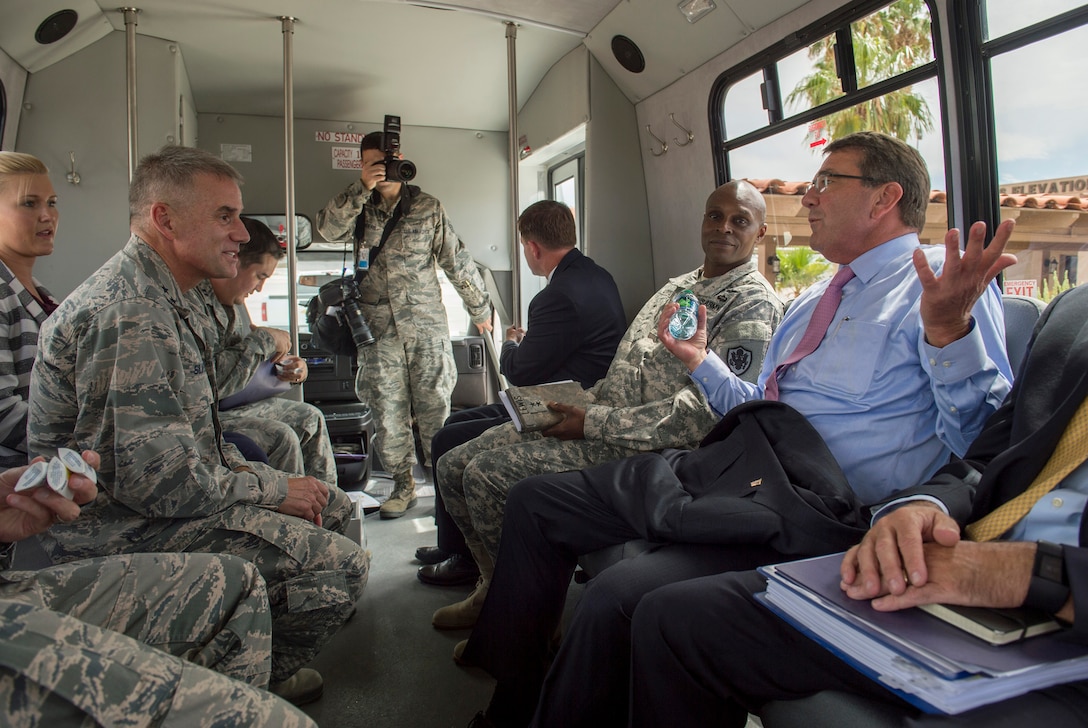 Defense Secretary Ash Carter, right, speaks with Maj. Gen. Jay B. Silveria, commander of the U.S. Air Force Warfare Center, as he visits Nellis Air Force Base, Nev., Aug. 26, 2015. DoD photo by U.S. Air Force Master Sgt. Adrian Cadiz