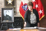 Sally Mauck, a descendant of the Travis family, shares artifacts of Col. William Travis during a ceremony Aug. 19, gifting two portraits of the legendary hero to Fort Sam Houston. 