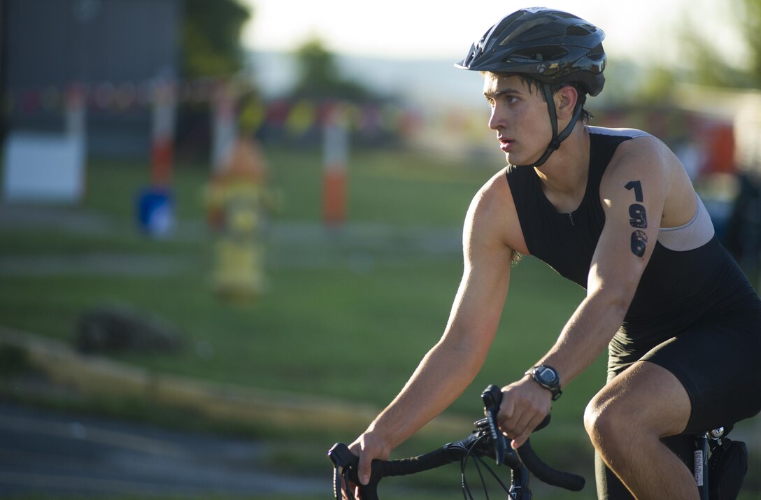 Triathletes compete in the Quantico Triathlon hosted by Marine Corps Base Quantico (MCBQ) at MCBQ, Va., Aug 22, 2015. The Quantico Triathlon is a three part event consisting of; a 750 meter open water swim, a 20k cycle tour of MCBQ, and a 5k run. (U.S. Marine Corps photo by Lance Cpl. Terry W. Miller Jr./Released)