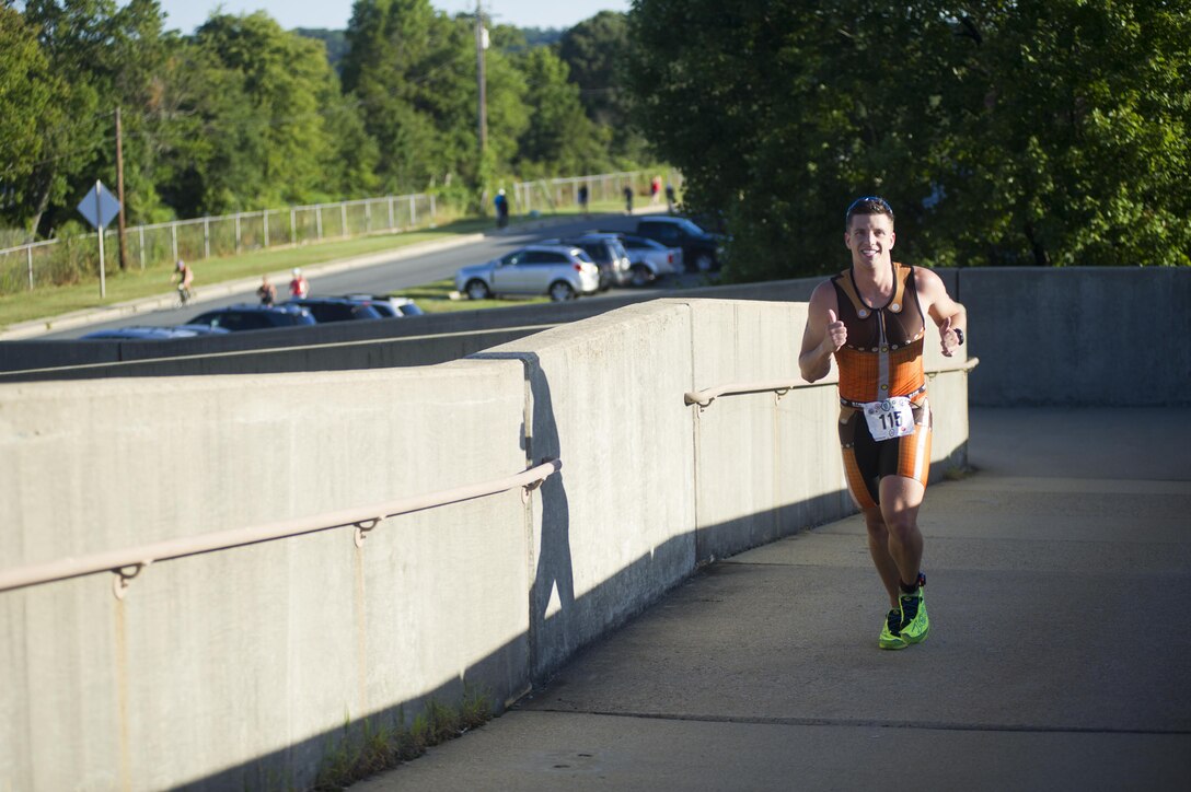 Triathletes compete in the Quantico Triathlon hosted by Marine Corps Base Quantico (MCBQ) at MCBQ, Va., Aug 22, 2015. The Quantico Triathlon is a three part event consisting of; a 750 meter open water swim, a 20k cycle tour of MCBQ, and a 5k run. (U.S. Marine Corps photo by Lance Cpl. Terry W. Miller Jr./Released)