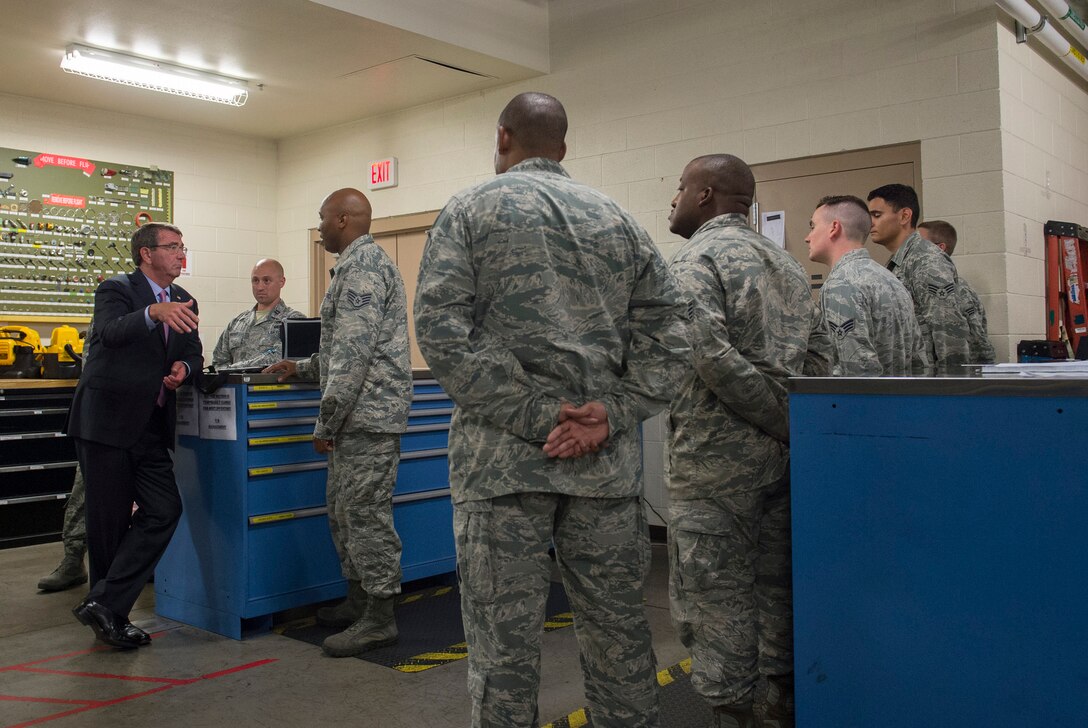 Defense Secretary Ash Carter speaks with airmen working as aircraft maintainers during a visit to Nellis Air Force Base, Nev., Aug. 26, 2015. Carter spoke with Airman and observed a Red Flag Exercise. 