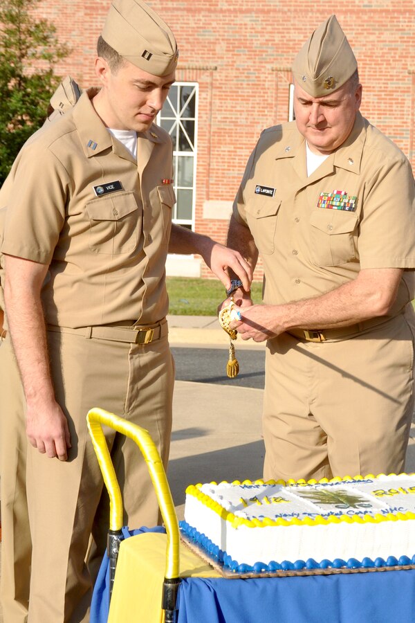 Lt. Justin Vice (left), general dentist, and Cmdr. Vincent LaPointe, oral surgeon division head cut the first slice of cake in celebration of the Naval Dental Corps’ 103rd birthday during a ceremony at the Naval Health Clinic Quantico, Aug. 21. The dental department maintains operational readiness of the Sailors and Marines on Marine Corps Base Quantico.