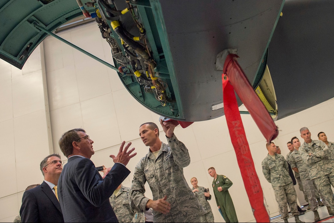 Defense Secretary Ash Carter speaks with an airman working as an aircraft maintainer during a visit to Nellis Air Force Base, Nev., Aug. 26, 2015. DoD photo by U.S. Air Master Master Sgt. Adrian Cadiz