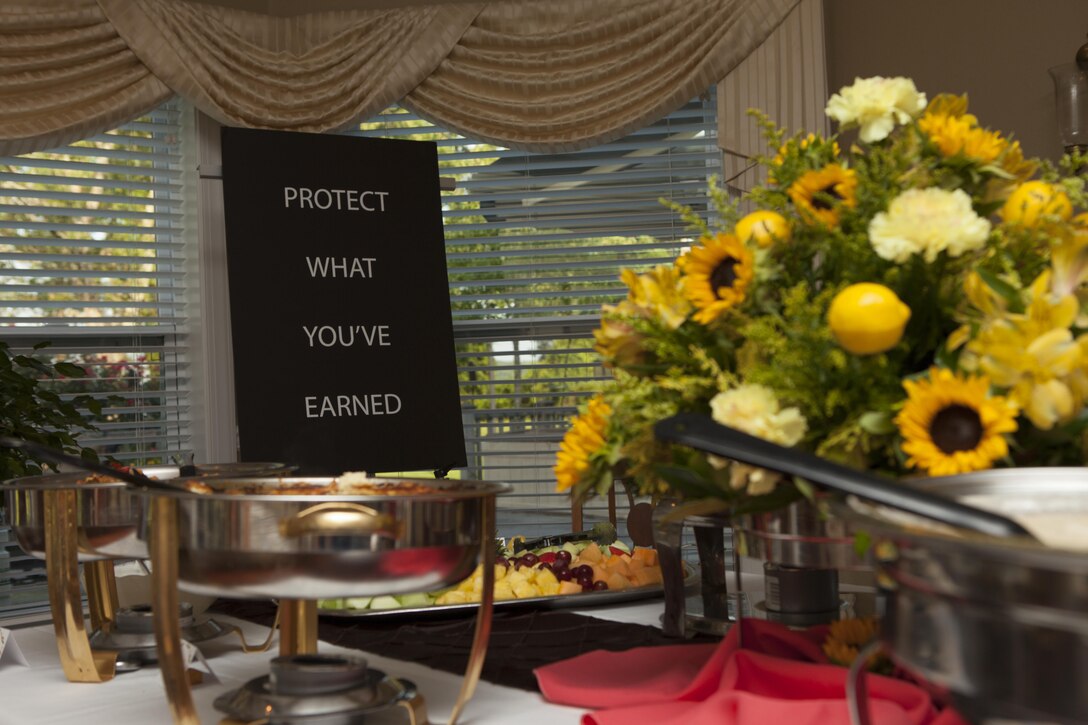 A sign advertising the Protect What You've Earned campaign is placed in the dining room where guests will be served breakfast at the home of U.S. Marine Corps Maj. Gen. William D. Beydleron, Camp Lejeune, N.C., Aug. 25, 2015. The campaign was created to encourage Marines to make the right decisions on and off duty. (U.S. Marine Corps photo by Lance Cpl. Sarah L. Blendowski, 2DMARDIV Combat Camera/Released)