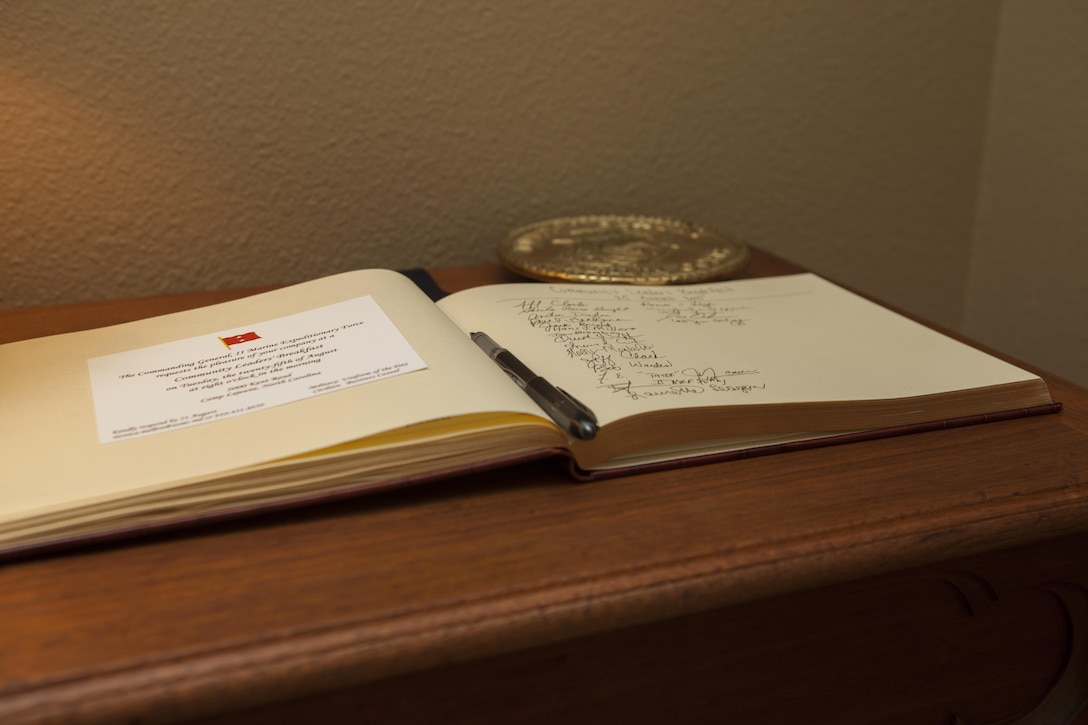 A guest book is placed in the entryway where guests sign in at the home of U.S. Marine Corps Maj. Gen. William D. Beydler Camp Lejeune, N.C., Aug. 25, 2015. The Protect What You've Earned campaign was created to encourage Marines to make the right decisions on and off duty. (U.S. Marine Corps photo by Lance Cpl. Sarah L. Blendowski, 2DMARDIV Combat Camera/Released)