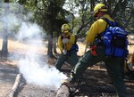 Oregon Army National Guard Soldiers practice smothering fires during wild land fires training at the Department of Public Safety Standards and Training in Salem, Ore., Aug. 25, 2015. The group is undergoing the training to assist the Oregon Department of Forestry during the 2015 firefighting season. The first group of 125 Soldiers were scheduled to deploy to the fire lines early on Aug. 26, and will be joined by 250 more Oregon citizen-Airmen and citizen-Soldiers who began their training at DPSST today, and are expected to deploy to the fire lines Aug. 30.