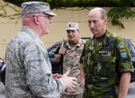 In this photo, Col. Christopher Cotts, Seventh Air Force chief of staff, greets Swedish Maj. Gen. Mats Engman, right, head of policy and plans department for the Swedish Armed Forces and Swedish Neutral Nations Supervisory Commission member, and Swiss Lt. Col. Christian Guillaume, Swiss delegate to the NNSC, during an observation tour during exercise Ulchi Freedom Guardian Aug. 24, 2015, at Osan Air Base, Republic of Korea.. The NNSC provides transparency to the international community by ensuring planning and operations are conducted with a "defensive and deterrent" nature. 