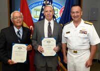 150826-N-PO203-103 ARLINGTON, Virginia (August 26, 2015) Rear Adm. Mat Winter, chief of naval research, presents the Vice Adm. Harold G. Bowen Award for Patented Inventions to Dr. Roshdy Barsoum, left, from the Office of Naval Research (ONR), and Mr. Phillip Dudt, from the Naval Surface Warfare Center Carderock Division, during a ceremony held at ONR in Arlington, Va. (U.S. Navy photo by John F. Williams/Released)