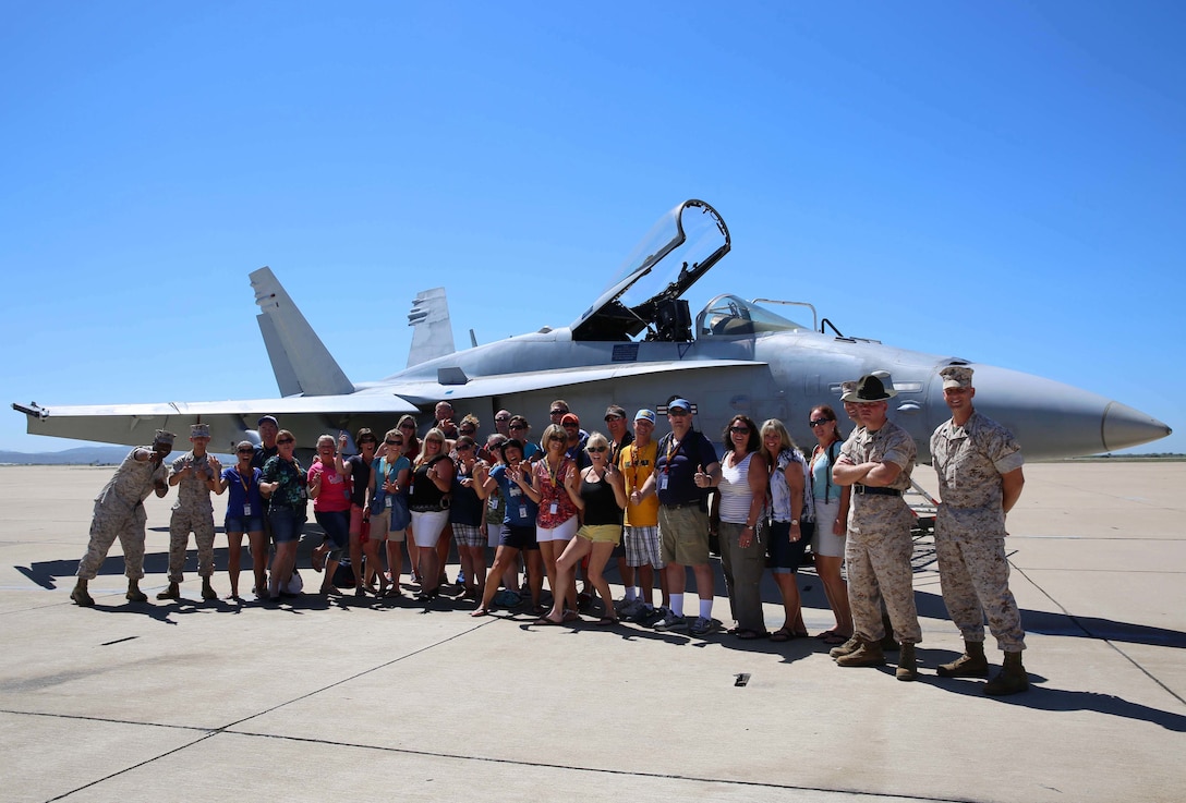 Marines and Educators with Recruiting Station Portland pose with an F-18 Hornet at Marine Corps Air Station Miramar, during the 2015 Educators Workshop. These teachers, coaches and counselors got to experience some of the physical challenges of Marine Corps basic training and talk to Marines operating in their occupational specialty. The educators saw many of the installation's services provided to the Marines including the Education Center, Moral Welfare Recreation Center and Chow Hall.