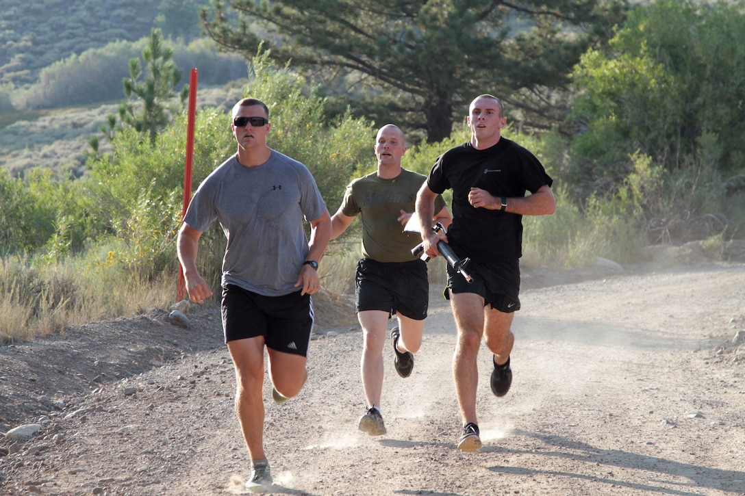 Captain Joshua Dewalt (left) runs with officer candidates during military training at Marine Corps Mountain Warfare Training Center here, Aug. 22, 2015. Officer candidates from Recruiting Station Sacramento as part of “Warrior Weekend.” The candidates hiked steep trails, competed in team exercises, and received classes as part of preparation for Officer Candidate School in Quantico, Va.