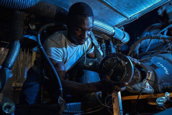 Senior Airman Dominique changes a compressor on an air conditioning unit at an undisclosed location in Southwest Asia August 19, 2015. The air conditioning unit supplies cold air to aircraft while they are performing ground operations. Dominique is an aerospace ground equipment mechanic assigned to the 380th Expeditionary Maintenance Squadron. (U.S. Air Force photo/Tech. Sgt. Christopher Boitz)