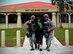 Senior Airmen Julian Perez, left, and Thomas Glymph, far right, 36th Security Forces Squadron patrolmen, assist Airman 1st Class Celeste Friedrichs, 736th Security Forces Squadron volunteer, during an active shooter exercise Aug. 26, 2015, at Andersen Air Force Base, Guam. The exercise replicated real-world events and was designed to enhance the training and readiness of first responders to threats to installations and units. (U.S. Air Force photo by Airman 1st Class Alexa Ann Henderson/Released)