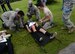 Airmen from the 36th Medical Operation Squadron tend to role-player ‘victims’ from an active shooter exercise during an active shooter exercise Aug. 26, 2015, at Andersen Air Force Base, Guam. The exercise tested capabilities of emergency responders and support agencies. (U.S. Air Force photo by Airman 1st Class Alexa Ann Henderson/Released)