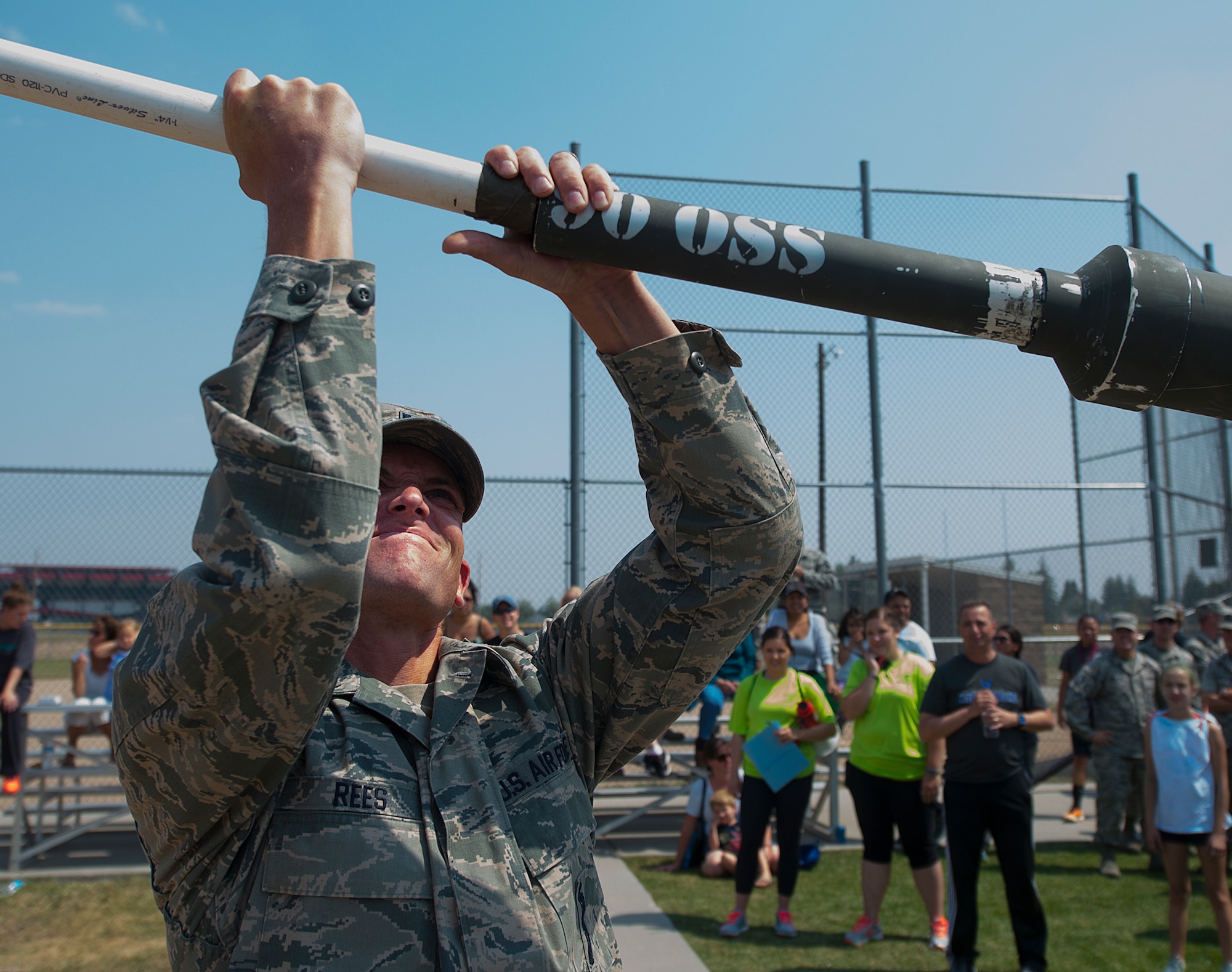 Capt. Jeff Rees, 321st Missile Squadron, loads a frozen buffalo “chip” into the muzzle of the 90th Operations Group's air gun in preparation for the buffalo chip toss competition part of the annual Frontiercade festivities on F.E. Warren Air Force Base, Wyo., Aug. 21, 2015. The buffalo chip toss brings a climatic end to the event as units use various methods to fling buffalo manure at a target more than 100 yards away. (U.S. Air Force photos by R.J. Oriez/Released)