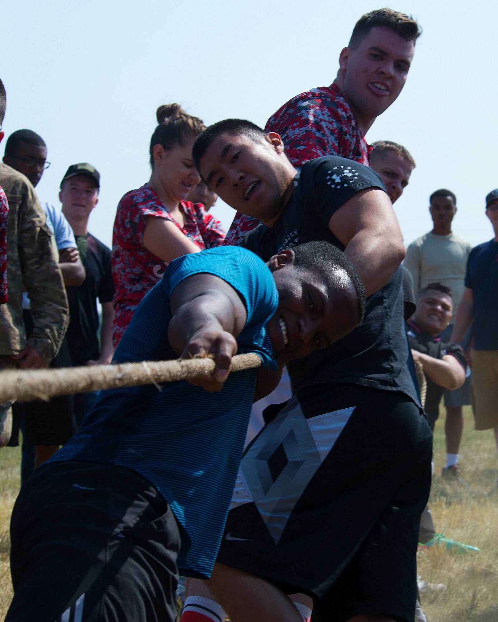 Chad Neal, Nate Nakamura and Kevin Tufts pull for the 90 Missile Security Forces Squadron in a tug-of-war match Aug. 21, 2015, during the annual Frontiercade festivities on F.E. Warren Air Force Base, Wyo. Each year, Airmen of the 90th Missile Wing and their families come together to compete in such events as horseshoes, volleyball and a buffalo-chip toss.  (U.S. Air Force photos by R.J. Oriez/Released)