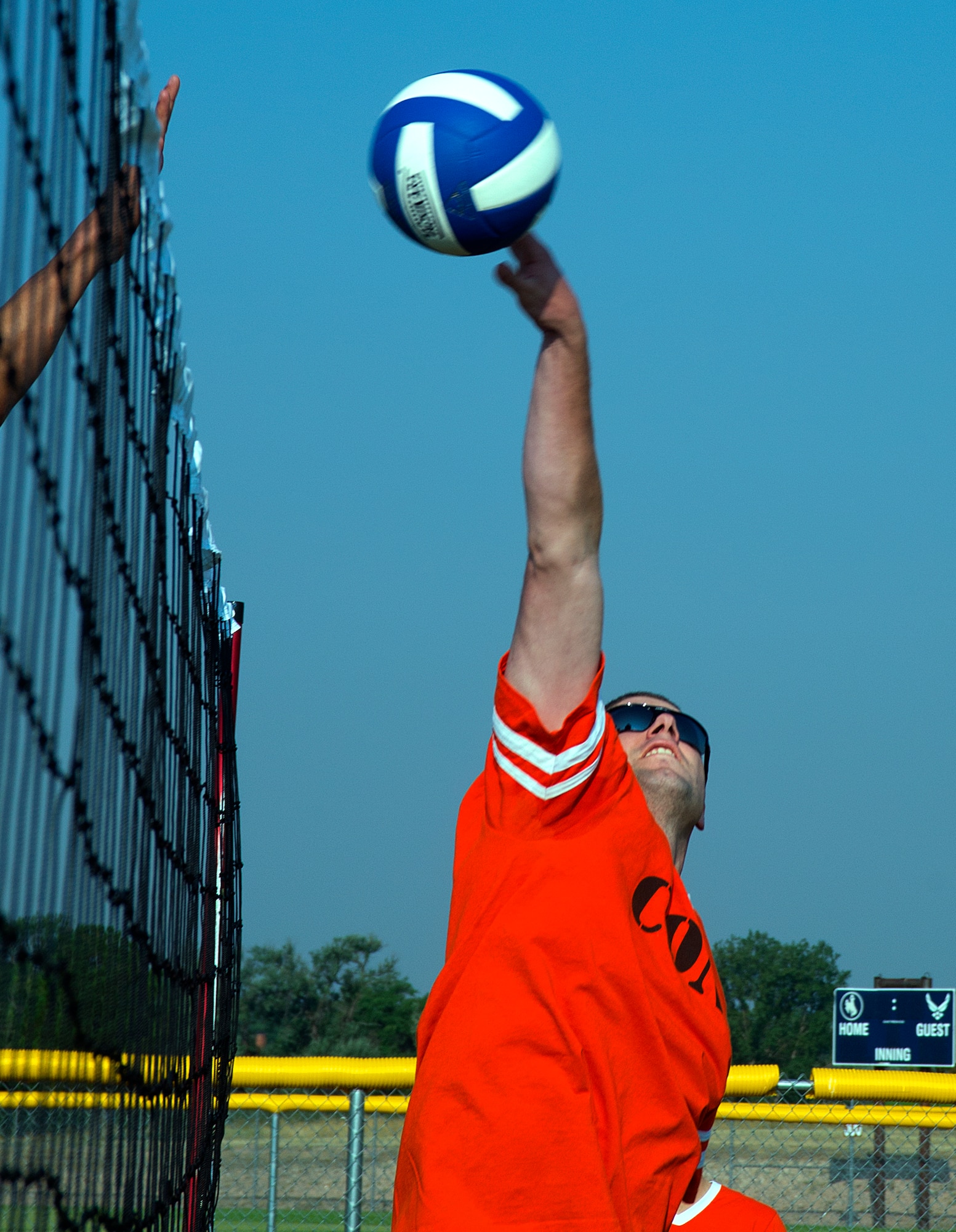 Derek Taylor, 90th Contracting Squadron, puts the ball over the net during a volleyball game at Aug. 21, 2015, during the annual Frontiercade festivities on F.E. Warren Air Force Base, Wyo. Each year, Airmen of the 90th Missile Wing and their families come together to compete in such events as horseshoes, volleyball and a buffalo-chip toss.  (U.S. Air Force photos by R.J. Oriez/Released)