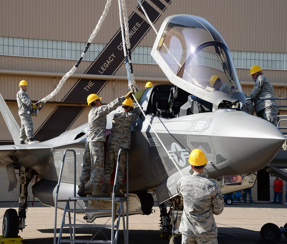 Airmen assigned to the 388th Equipment Maintenance Squadron prepare an F-35B aircraft for a simulated sling lift during Crash Damaged Disabled Aircraft Recovery Program training at Hill Air Force Base, Utah, Thursday, Aug. 27, 2015. Training was provided by an F-35 depot team assigned to the 570th Aircraft Maintenance Squadron at Hill and personnel from Edwards AFB, Calif. The training ensures Hill Airmen are prepared for the base’s future operational F-35 mission. Firefighters and explosive ordnance disposal personnel also participated in the CDDARP training. (U.S. Air Force photo by R. Nial Bradshaw/Released)