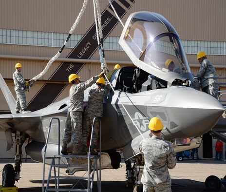 Airmen assigned to the 388th Equipment Maintenance Squadron prepare an F-35B aircraft for a simulated sling lift during Crash Damaged Disabled Aircraft Recovery Program training at Hill Air Force Base, Utah, Thursday, Aug. 27, 2015. Training was provided by an F-35 depot team assigned to the 570th Aircraft Maintenance Squadron at Hill and personnel from Edwards AFB, Calif. The training ensures Hill Airmen are prepared for the base’s future operational F-35 mission. Firefighters and explosive ordnance disposal personnel also participated in the CDDARP training. (U.S. Air Force photo by R. Nial Bradshaw/Released)