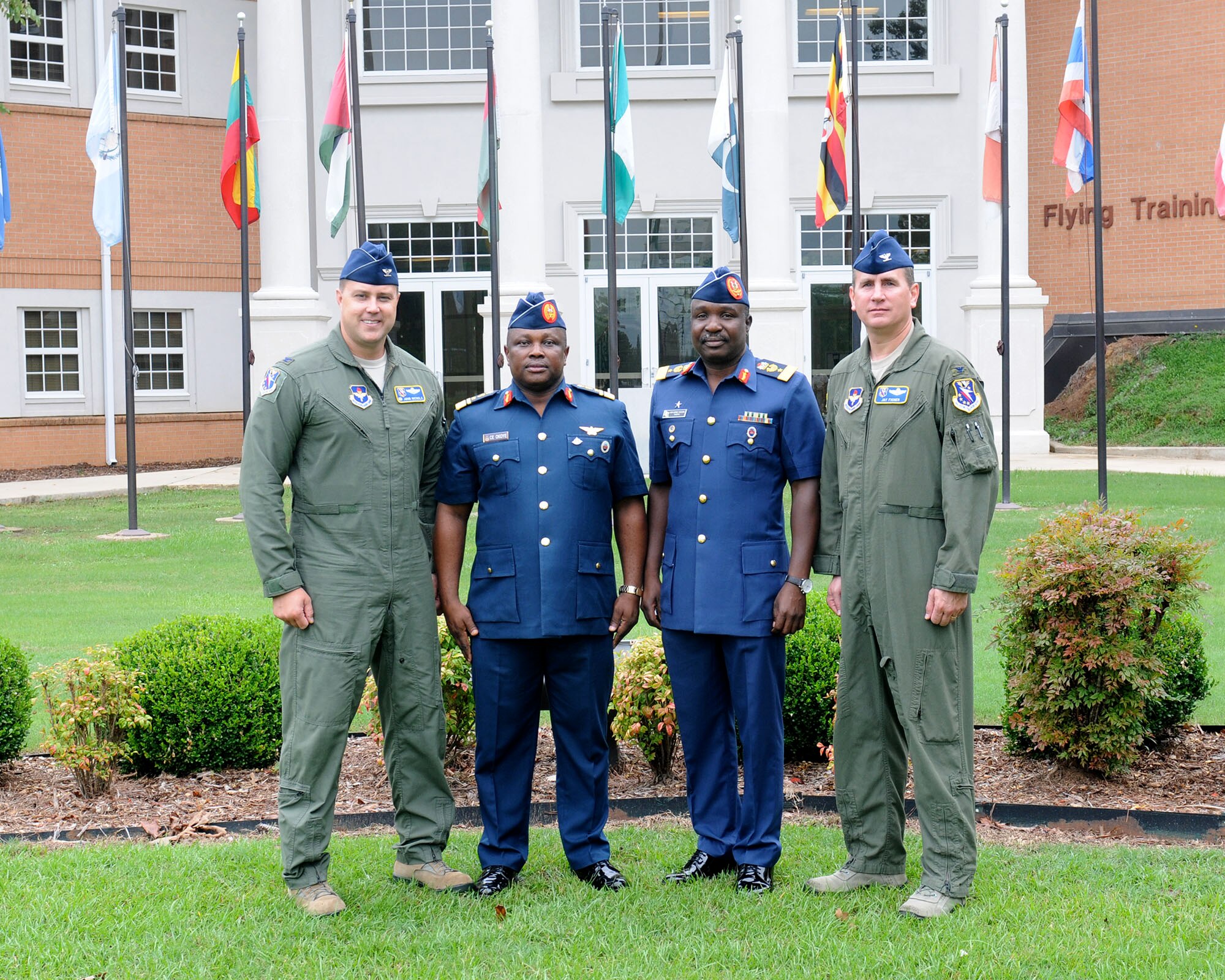 Col. John Nichols, 14th Flying Training Wing Commander, left, and Col. James Fisher, 14th FTW Vice Commander, right, stand with Nigerian air force Director of Training, Air Vice Marshal Christopher Emeka Okoye, center left, and Nigerian Embassy Naval and Air Attaché Air Commodore Muhammad Aminu Yakubu, center right, Aug. 24 on Columbus Air Force Base, Mississippi. Arriving from San Antonio, the delegation visited Columbus AFB to check in on the Nigerian air force student currently in pilot training here before traveling to Vance AFB, Oklahoma. (U.S. Air Force photo/Melissa Doublin) 