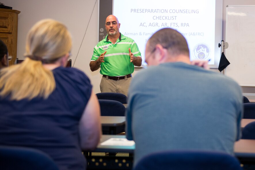 Derrick Harris, 23d Force Support Squadron Survival Benefit Plan counselor, speaks to retiring members about the SBP  at a Group Pre-separation Counseling briefing Aug. 25, 2015, at Moody Air Force Base, Ga. The SBP is a voluntary program providing survivors of participating retirees a monthly income beginning when the member dies and retired pay stops. (U.S. Air Force photo by Airman 1st Class Greg Nash/Released)