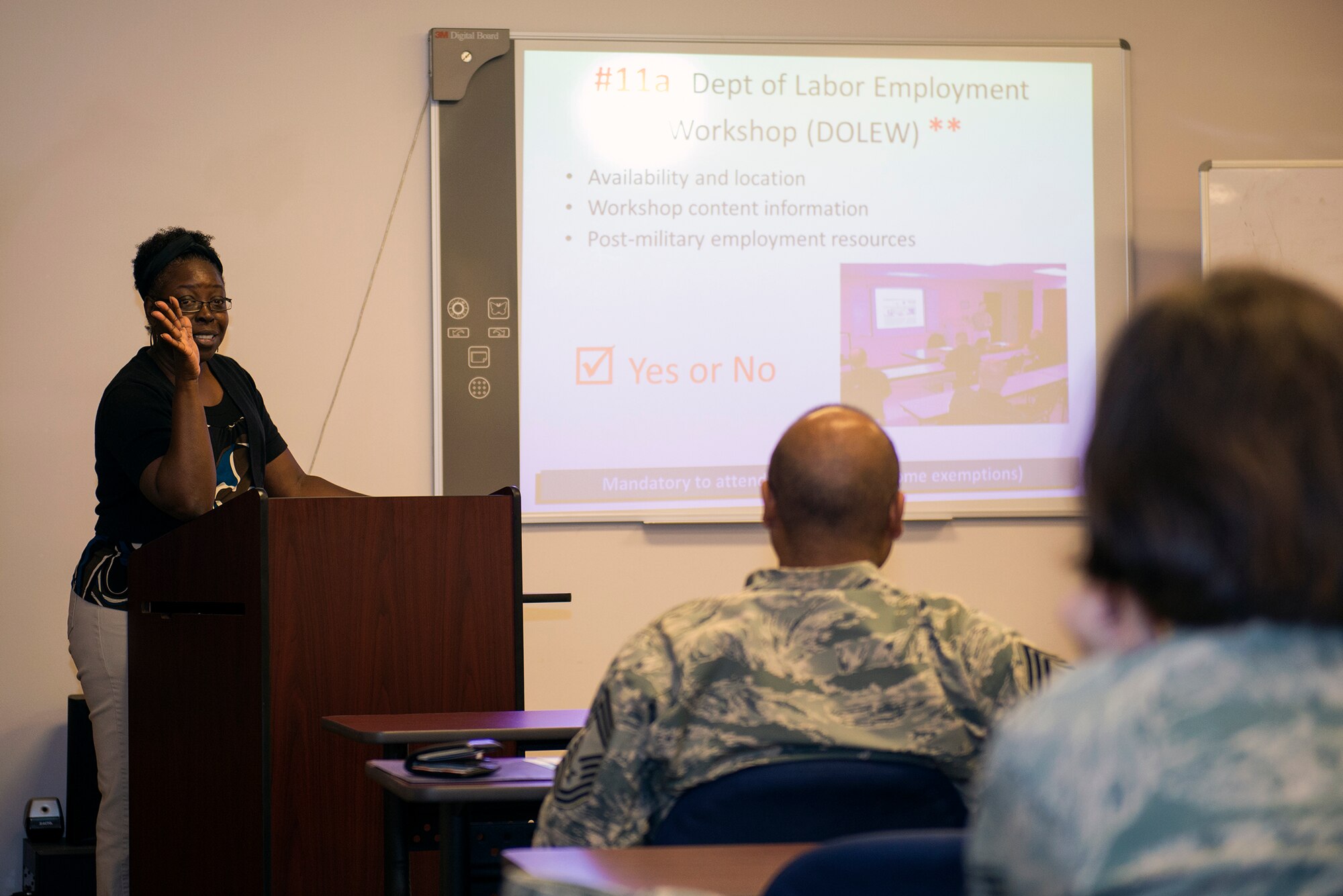 Sharon Register, 23d Force Support Squadron community readiness specialist, speaks during a Group Pre-separation Counseling briefing Aug. 25, 2015, at Moody Air Force Base. Register discussed the difficulties members may incur after leaving the military which can affect individual’s home lives, employment statuses, and income. (U.S. Air Force photo by Airman 1st Class Greg Nash/Released) 