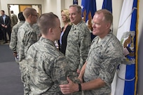 Chief Master Sergeant of the Air Force James A. Cody, Air Force Chief of Staff General Mark A. Welsh III and Secretary of the Air Force Deborah Lee James, congratulate Airmen who will soon complete Airmen’s Week Aug. 27, 2015, at Joint Base San Antonio-Lackland’s Pfingston Reception Center. The Airmen received a copy of "America's Air Force: A Profession of Arms," the next evolution of the "Little Blue Book" previously released in 1997. The new book gives Airmen instant access to the core values, codes and creeds that guide Airmen as they serve in the Profession of Arms. The book will be distributed to all new Airmen before transitioning to technical training and available online through Air Force e-publishing. (U.S. Air Force photo by Johnny Saldivar/Released)  