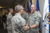 Chief Master Sergeant of the Air Force James A. Cody congratulates an Airman attending Airmen’s Week Aug. 27, 2015, at Joint Base San Antonio-Lackland’s Pfingston Reception Center. The Airmen received a copy of "America's Air Force: A Profession of Arms," the next evolution of the "Little Blue Book" previously released in 1997. The new book gives Airmen instant access to the core values, codes and creeds that guide Airmen as they serve in the Profession of Arms. The book will be distributed to all new Airmen before transitioning to technical training and available online through Air Force e-publishing. (U.S. Air Force photo by Johnny Saldivar/Released)  