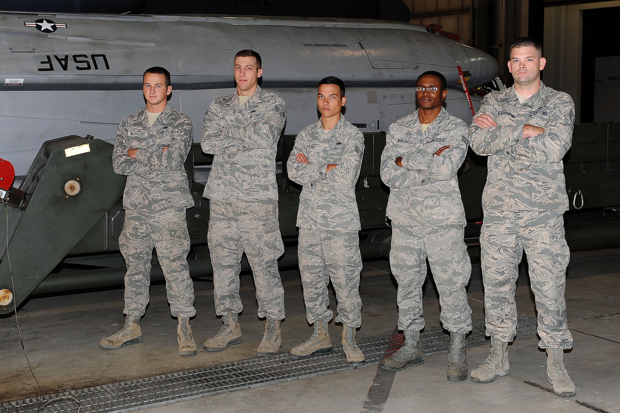 From left to right, Senior Airman Austin Weatherby, Senior Airman Lindsey Eckel, Senior Airman William Atkins, Staff Sgt. Timothy McDowell and Staff Sgt. Anthony Mitchamore, 705th Munitions Squadron high bay, pose in front of a rotary launcher at Minot Air Force Base, N.D., Aug. 21, 2015. Two members from the team competed in last year’s Global Strike Challenge, which took second place. This year they will be coming harder and plan on winning it all. The team is very confident as they practice day-in and day -out and will be bringing their “A”-game to the challenge. (U.S. Air Force photo / Senior Airman Kristoffer Kaubisch)