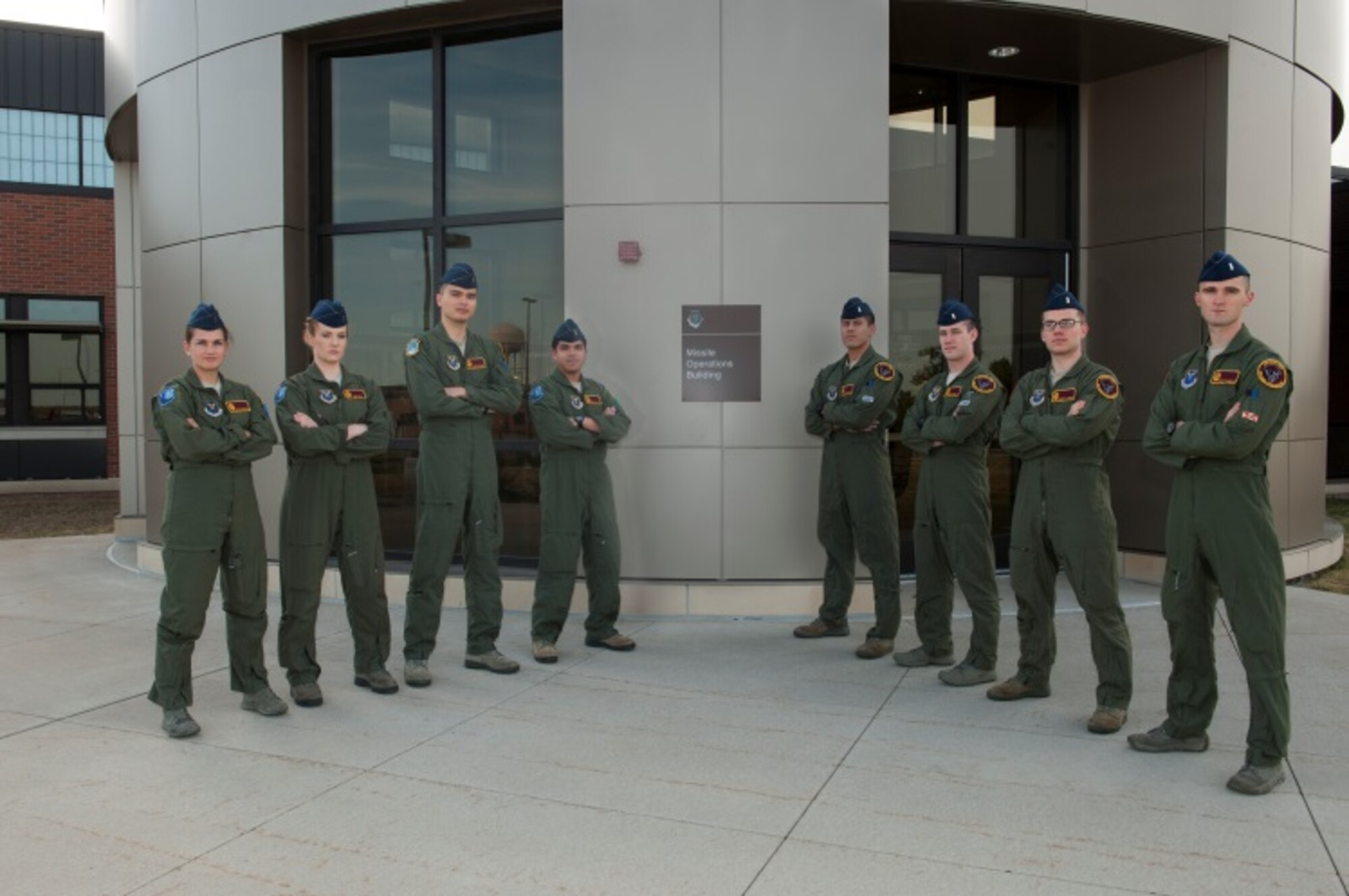 From left to right, 1st Lt. Morgan Emerson, 741st Missile Squadron deputy commander, 1st Lt. Emily Gill, 741st MS crew commander, 1st Lt. James Moore, 740th Missile Squadron backup crew commander, 2nd Lt. Jose Luis Talampas, 740th MS backup deputy crew commander, 1st Lt. Carlos Ruiz, 742nd Missile Squadron combat crew commander, 2nd Lt. Ben O’Neal, 742nd MS deputy crew commander, 2nd Lt. Robert Jager, 740th MS deputy crew commander, and 1st Lt. Mark Flaherty, 740th MS combat crew commander, stand in front of the Missile Operations building at Minot Air Force Base, N.D., Aug. 20, 2015. Minot’s 91st Operations Group Global Strike Challenge team currently holds the crown for best operations group in Air Force Global Strike Command following 2014 GSC. The team hopes to build off that momentum and learn from the few mistakes they made to do even better this year. (U.S. Air Force photo/Airman 1st Class Christian Sullivan)