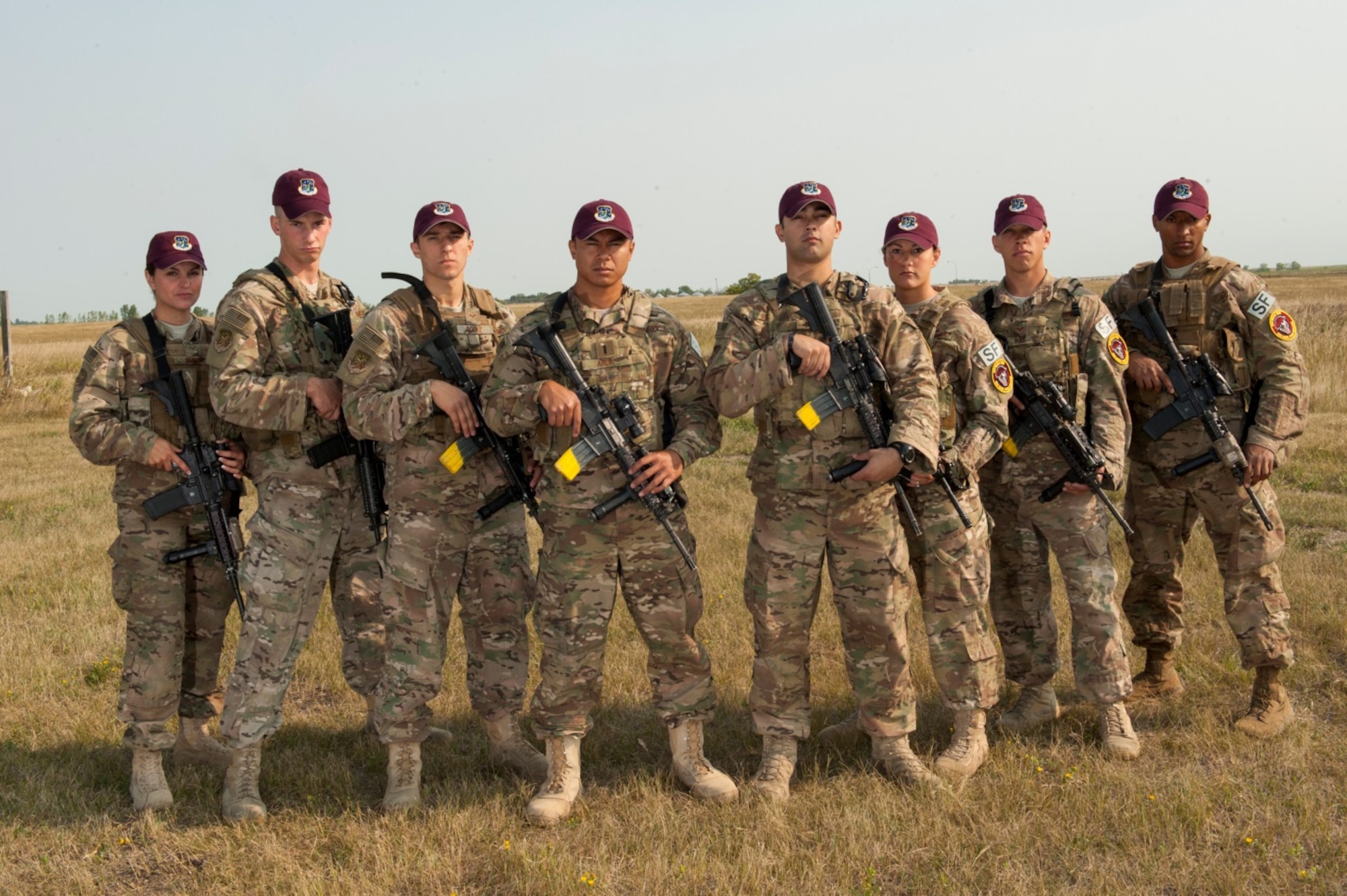 From left to right, Senior Airman Hannah Henry, Senior Airman Brandon Weese and Senior Airman Cody Poole, 91st Missile Security Forces Squadron Global Strike Challenge team members, 1st Lt. Kschristopher Anda and Staff Sgt. Jesse Koritar, 91st MSFS GSC team captains, Staff Sgt. Christina Lee, Staff Sgt. Michael Ray and Airman 1st Class Andreas Wiggins, 91st MSFS GSC team members, pose at Minot Air Force Base, N.D., Aug. 26, 2015. To train for Global Strike Challenge, the team has trained twice a day, along with working on their tactics and team work as well as going to the shoot house to practice with the M4 Carbine. Koritar thinks their dedication and training sets them apart from other teams and having two returning members from the 2014 GSC will help them win this year’s competition. (U.S. Air Force photo/Airman 1st Class Christian Sullivan)