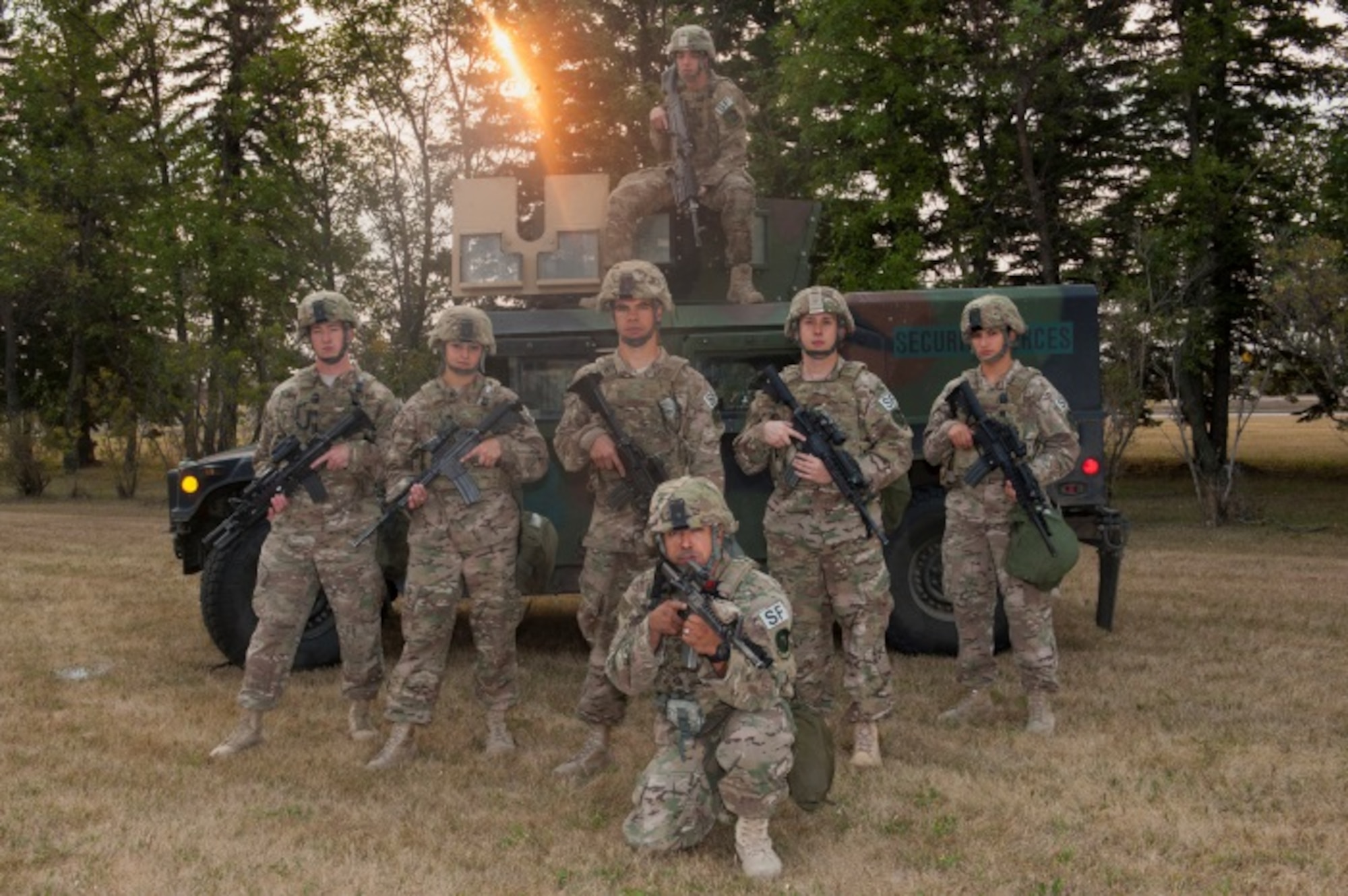 From left to right, Airman 1st Class Jesse Daniel, Airman 1st Class Ethan Fox, Airman 1st Class Jamie Jenks, Airman 1st Class Jade Swain, Senior Airman Jacob Shabenas, Airman 1st Class Ethan Fox on top of the Humvee and Airman 1st Class Amanda Gordon, 5th Security Forces response force members, and Master Sgt. Jason Garo, 5th Security Forces team leader, pose in front of a Humvee at Minot Air Force Base, N.D., Aug. 21, 2015. In 2014, the 5th Security Forces Squadron team failed to win at the Global Strike Challenge, but this year they have been using last year’s defeat to go back and win this year. To train, they have incorporated other squadrons within the wing such as the explosive ordinance disposal squadron and the medical squadron to help with their training as well as push their physical and mental limits. (U.S. Air Force photo/Airman 1st Class Christian Sullivan)
