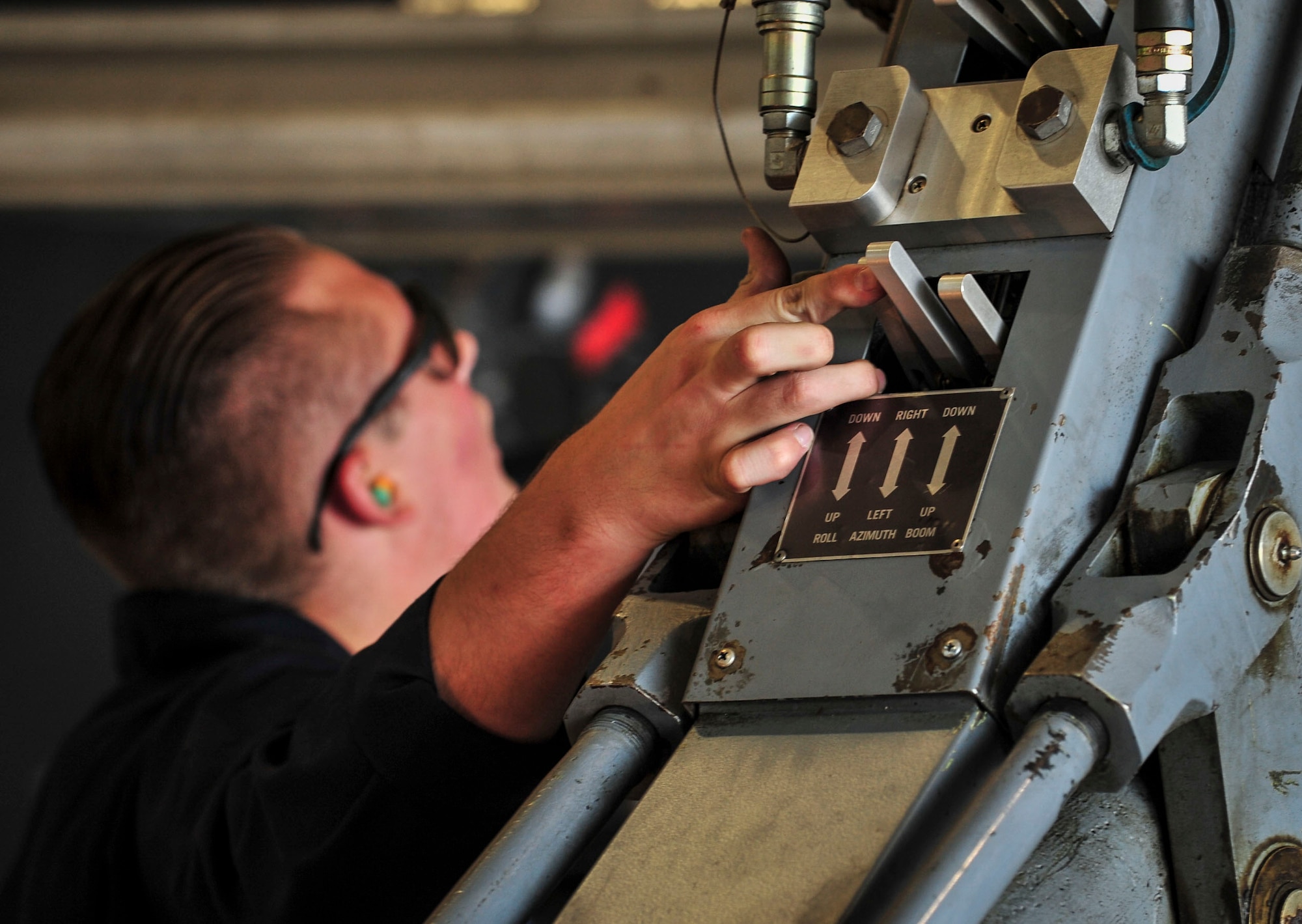 Airman 1st Class James Rutt, 5th Aircraft Maintenance Squadron weapons load crew member, makes fine tuned adjustments to a “jammer” carrying a B-52H Stratofortress weapon system at Minot Air Force Base, N.D., Aug. 24, 2015. Rutt and his team were required to load four weapons onto the aircraft as part of Air Force Global Strike Command’s Global Strike Challenge Competition and used constant communication to ensure the weapons were loaded quickly, safely and effectively. (U.S. Air Force photo/Senior Airman Stephanie Morris)